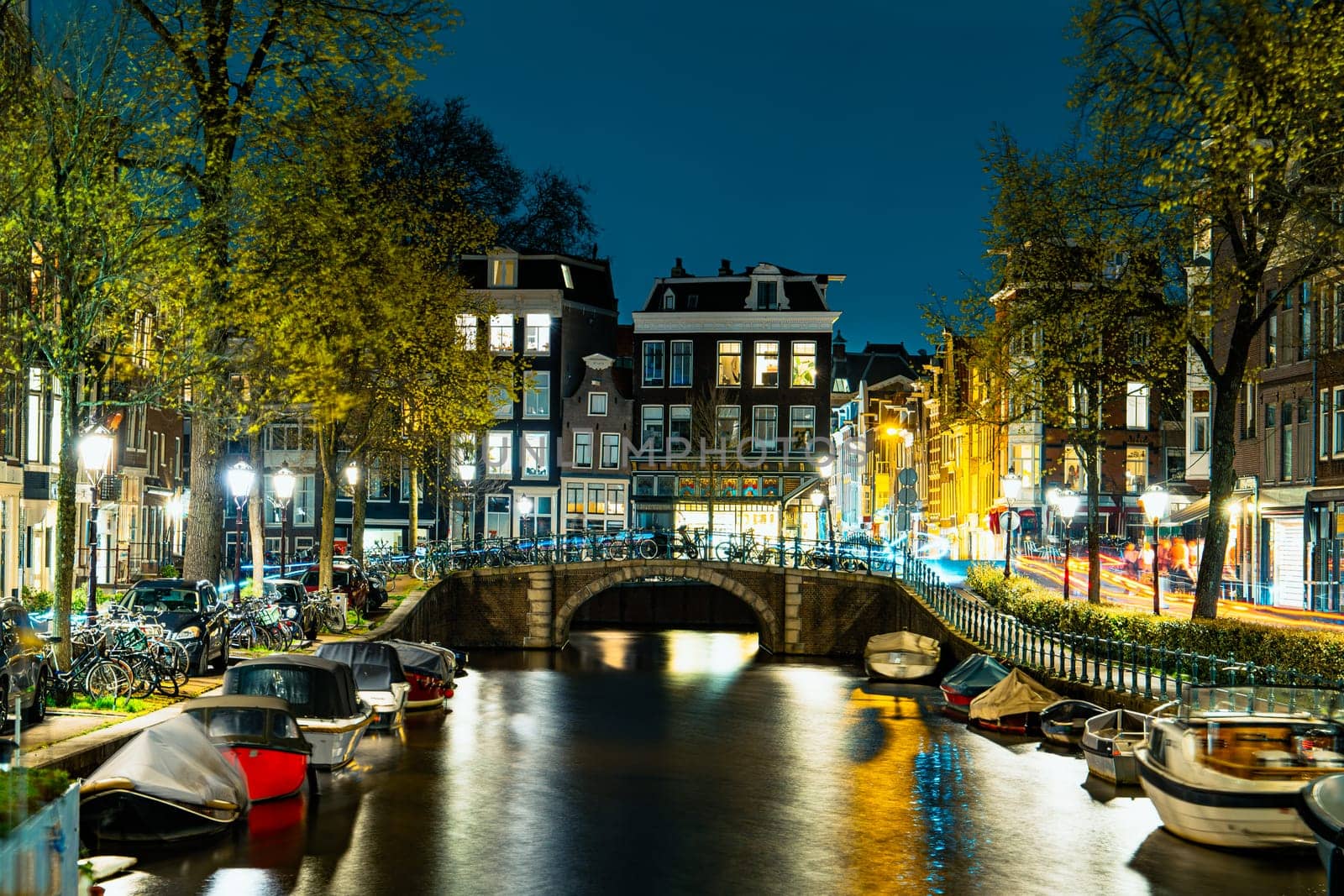 Captivating Night in Amsterdam: A Mesmerizing Long Exposure Photo of Amsterdam's Nighttime Canals.