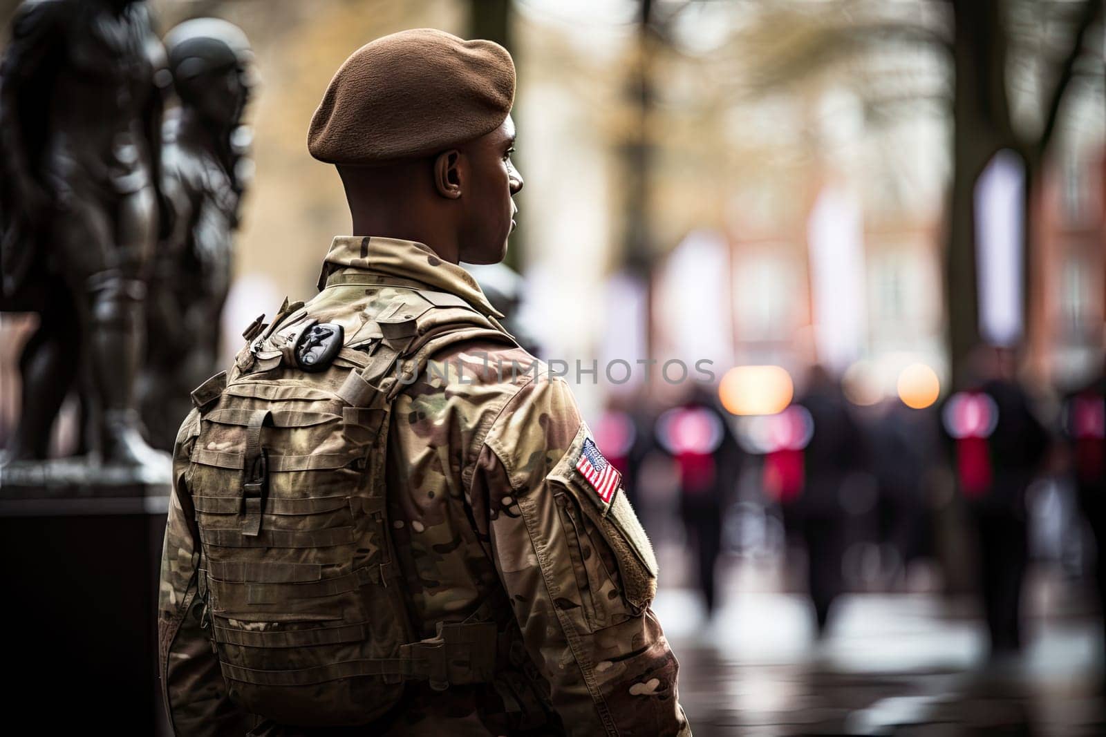 a soldier standing in front of a statue with his back turned to the camera and looking away from the camera