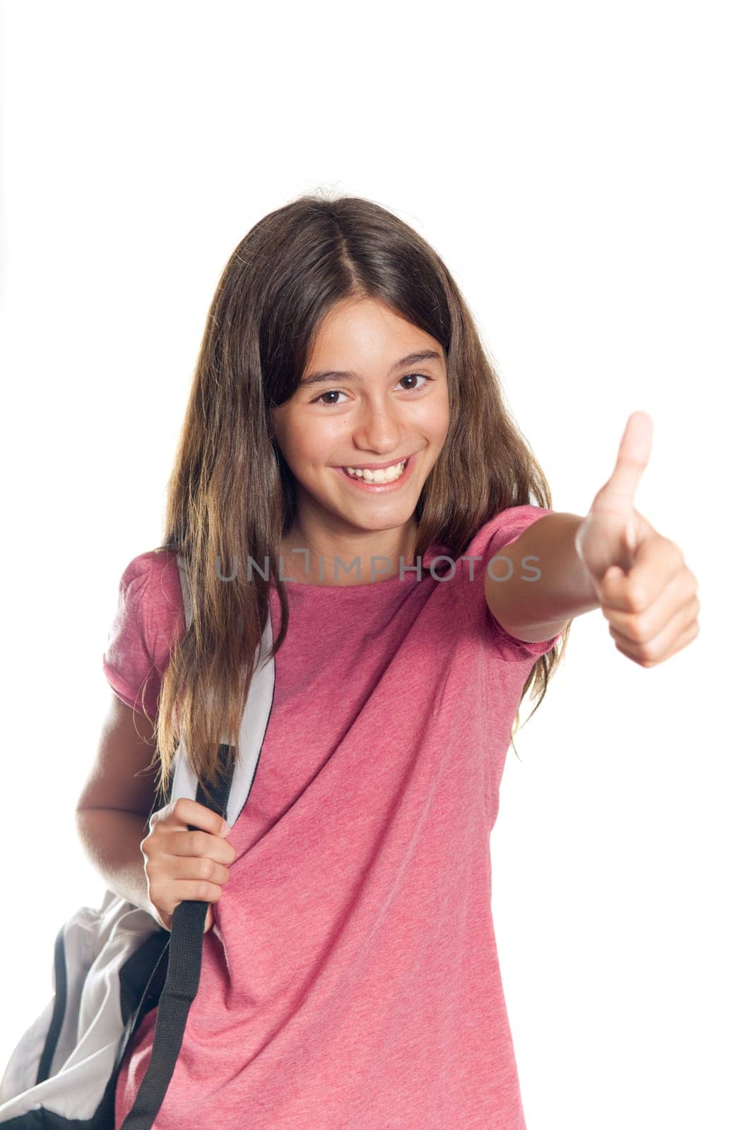 Positive girl showing a thumbs up against white