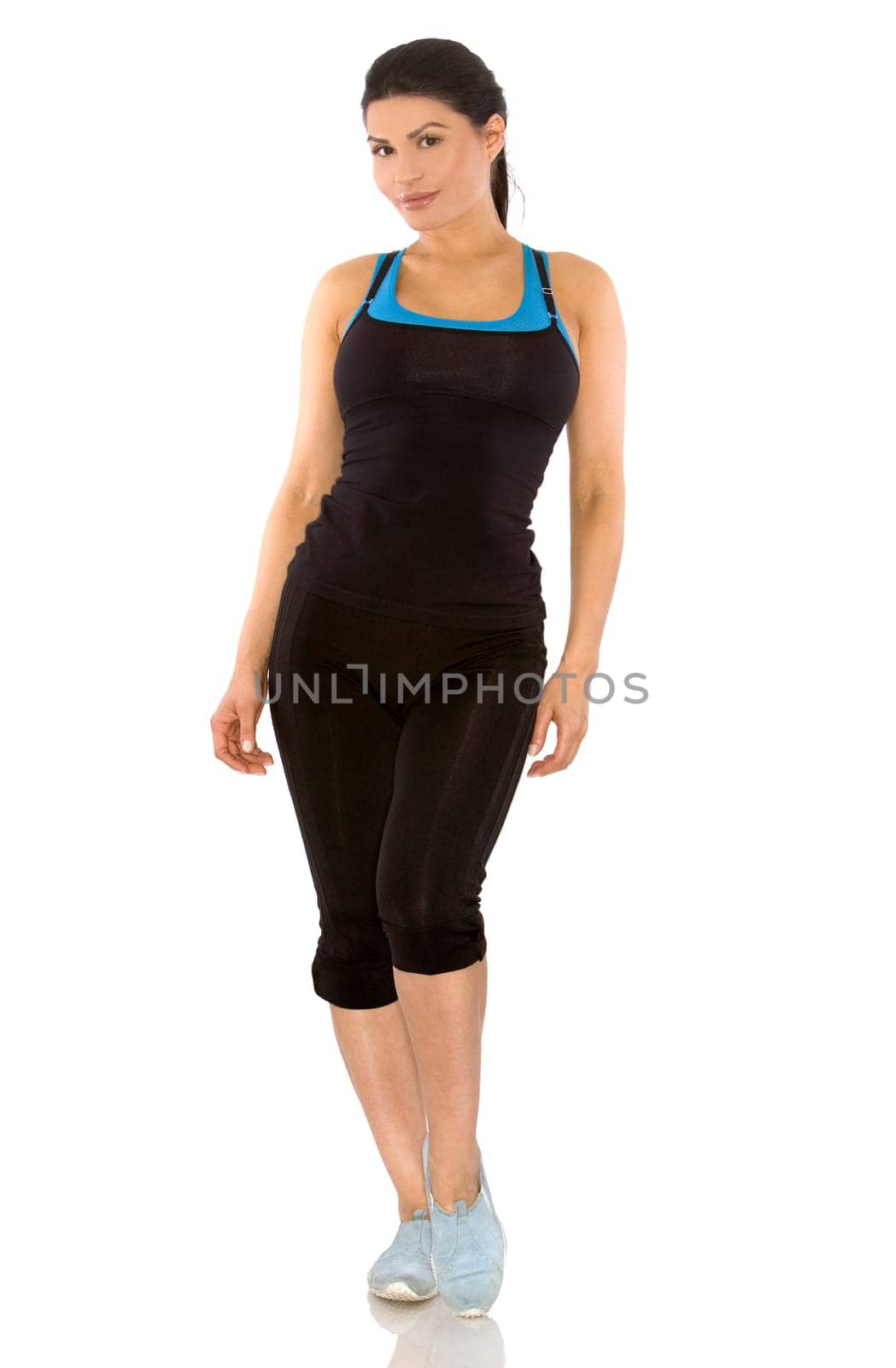 pretty brunette wearing sport outfit on white background