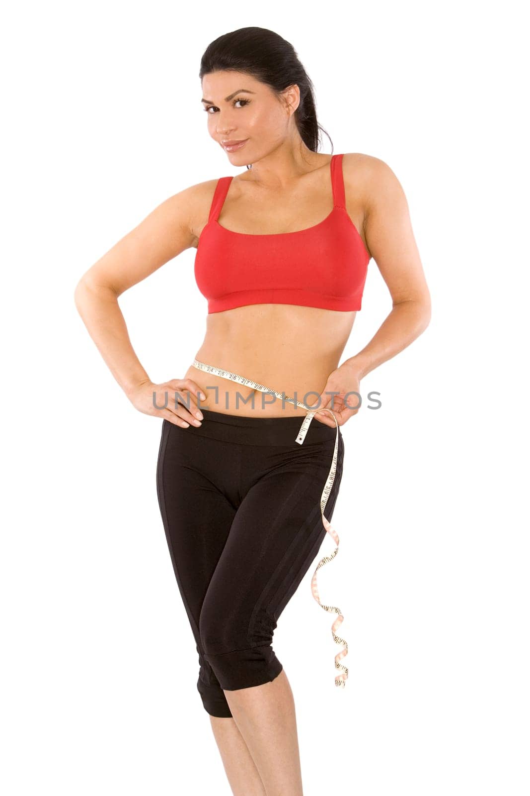 pretty brunette wearing sport outfit on white background