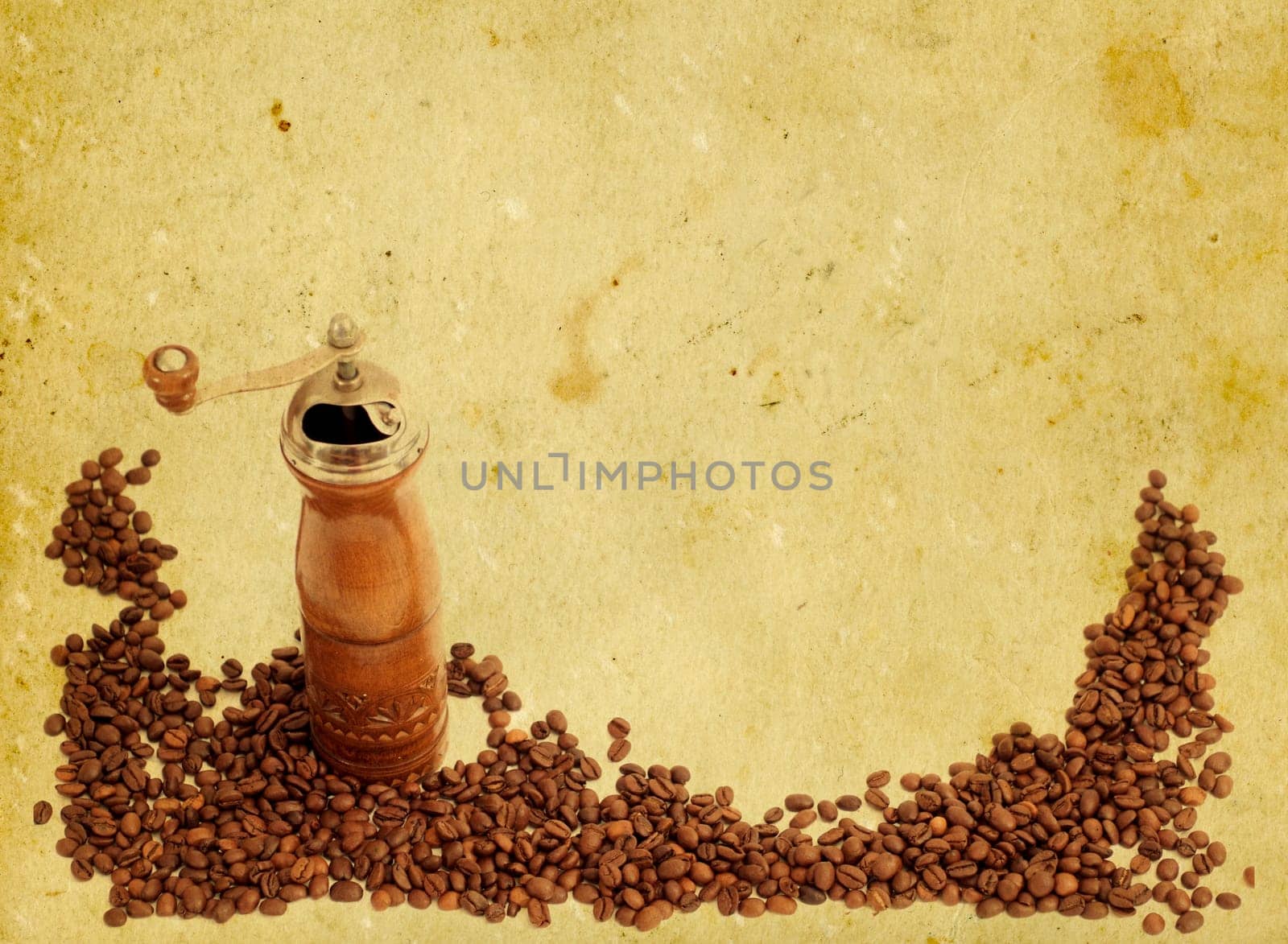Coffee grinder on old paper background