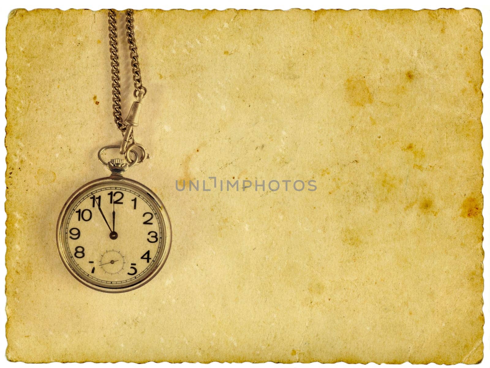 Pocket clock on old paper. Isolated on white.