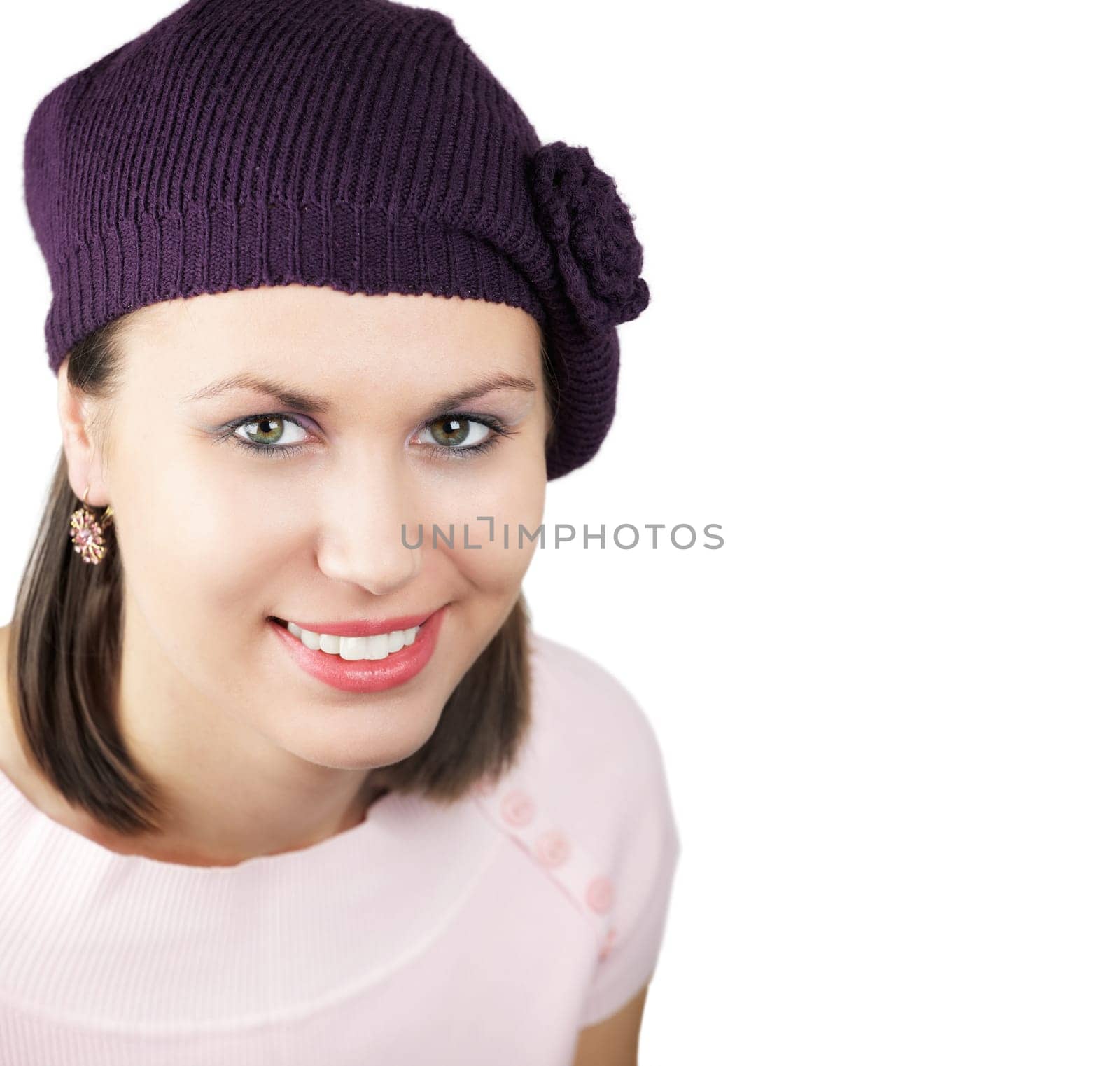 Beautiful young woman with purple hat isolated on white background.