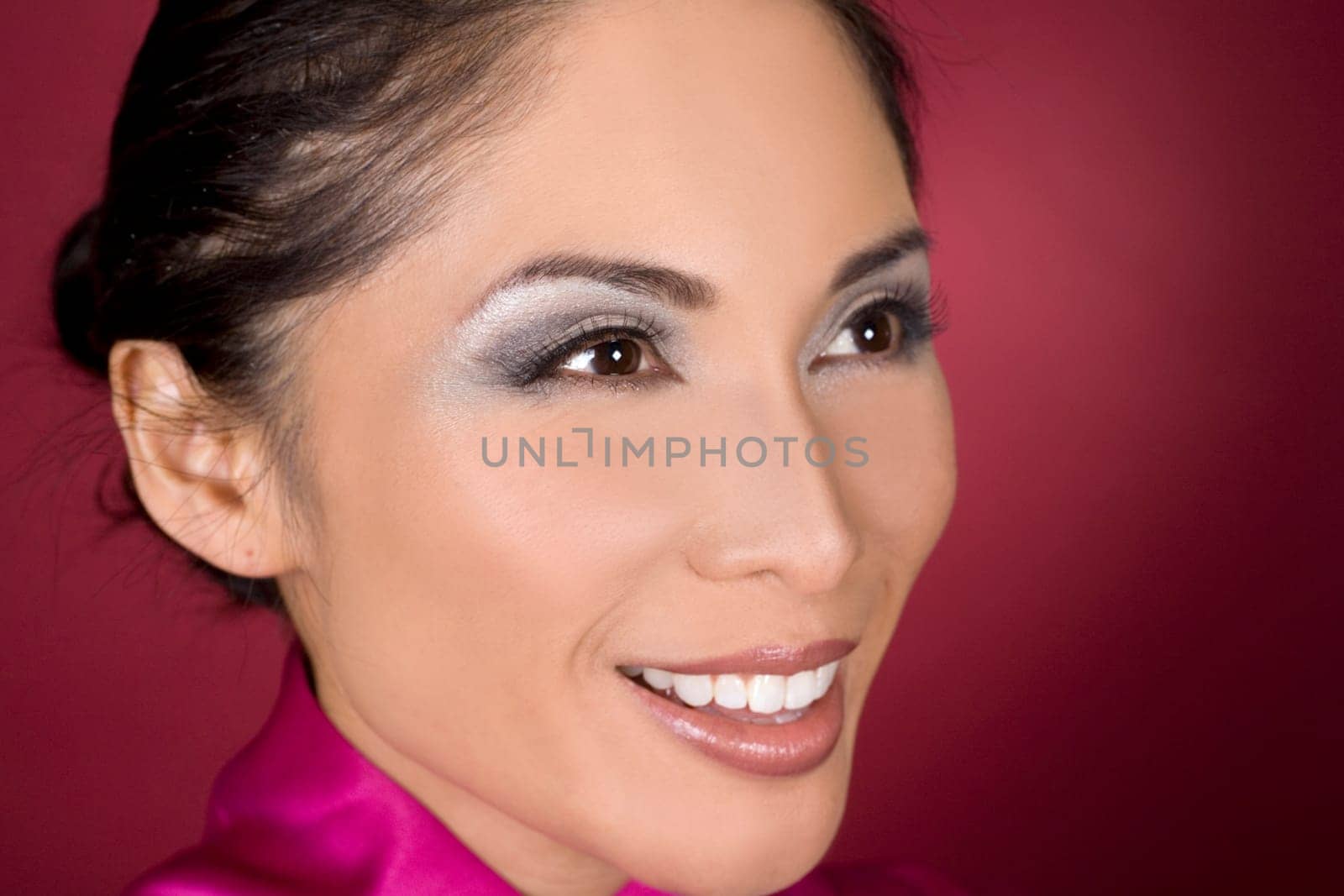 pretty asian woman wearing kimono on red background