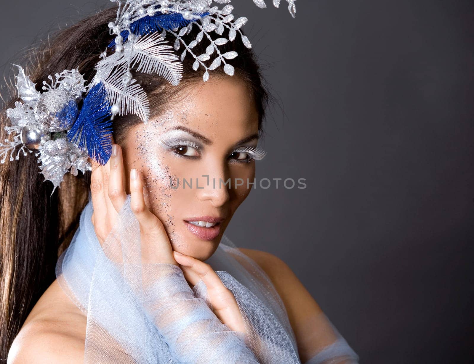 pretty brunette woman wearing white and silver accessories