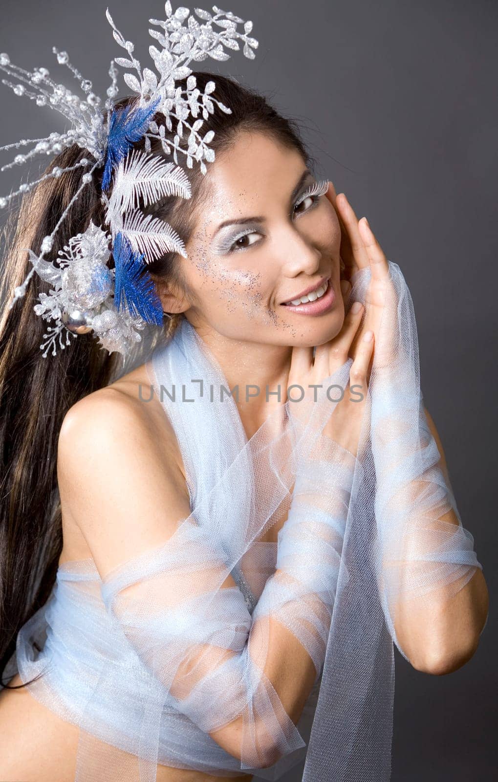 pretty brunette woman wearing white and silver accessories