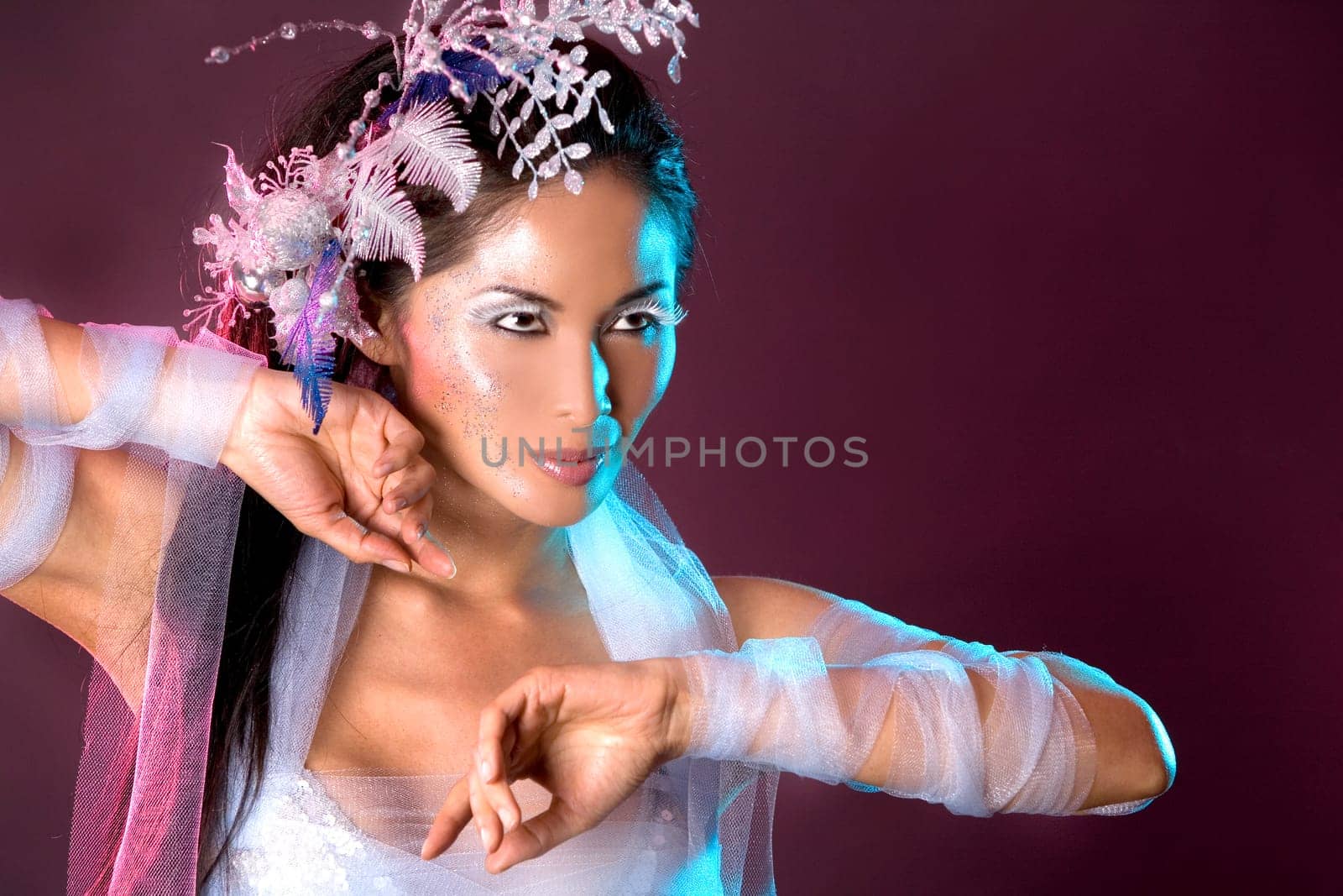 pretty brunette woman wearing white and silver accessories