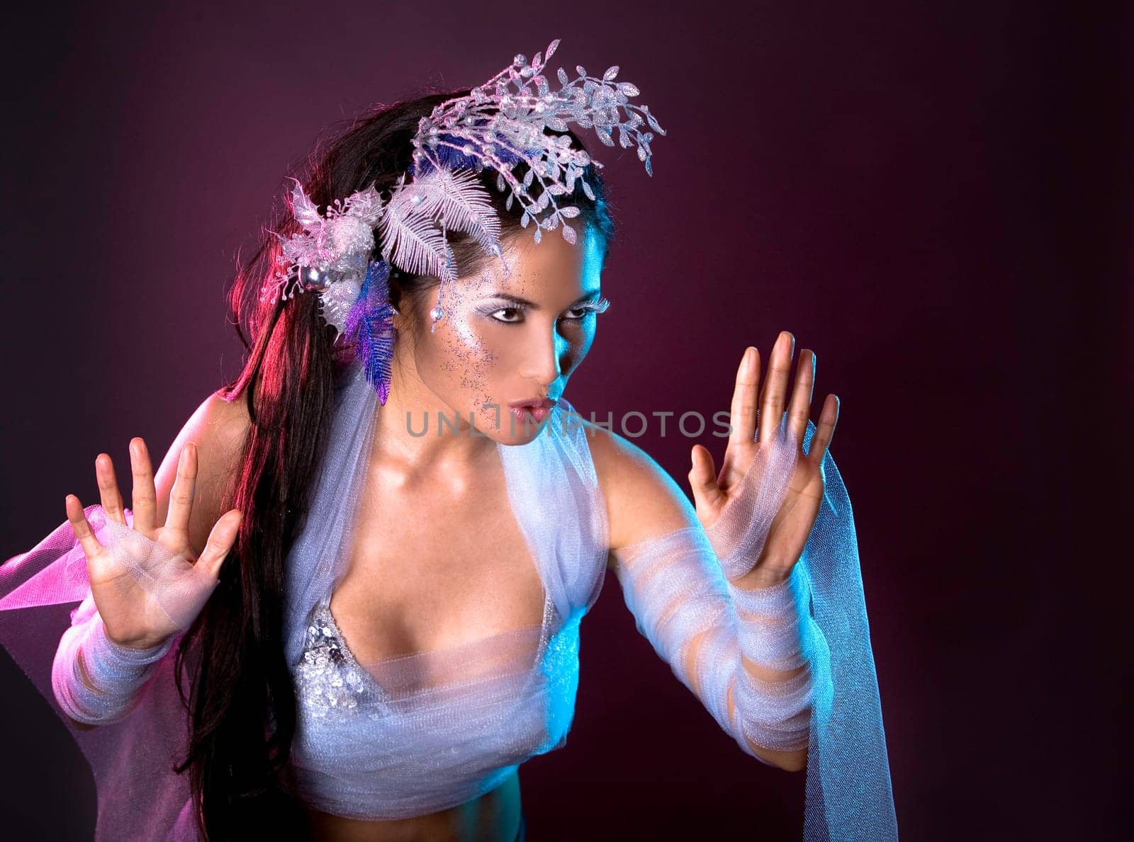 pretty brunette woman wearing white and silver accessories
