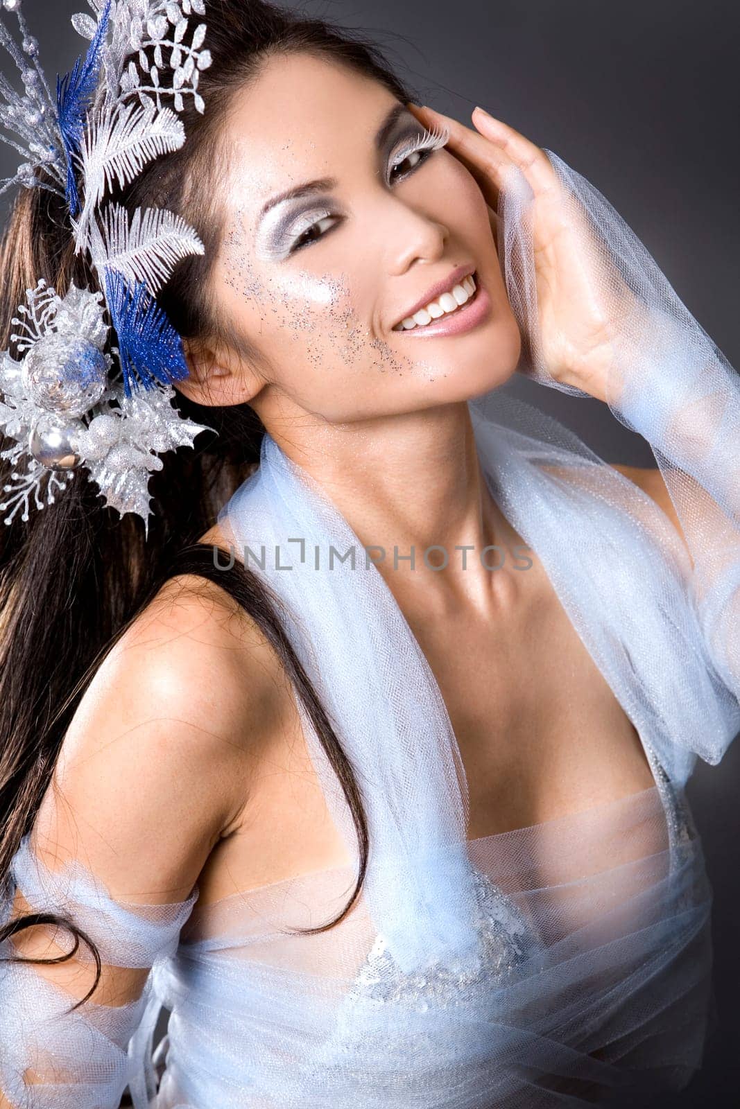 pretty brunette woman wearing white and silver accessories