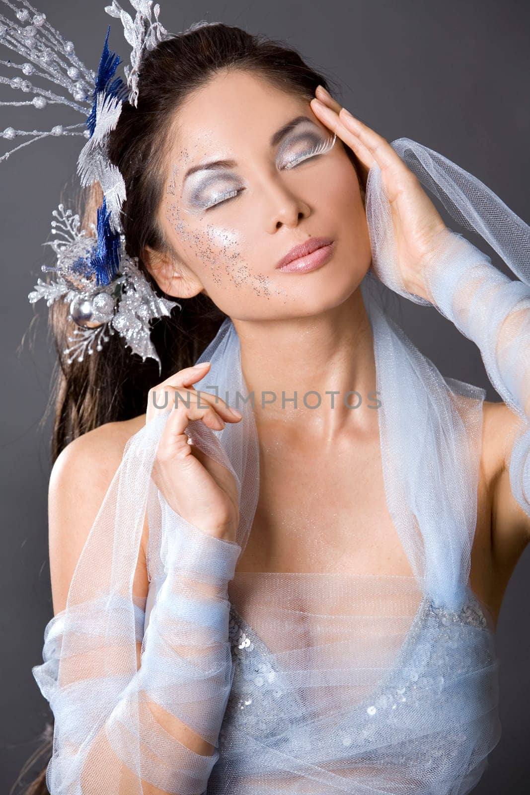 pretty brunette woman wearing white and silver accessories
