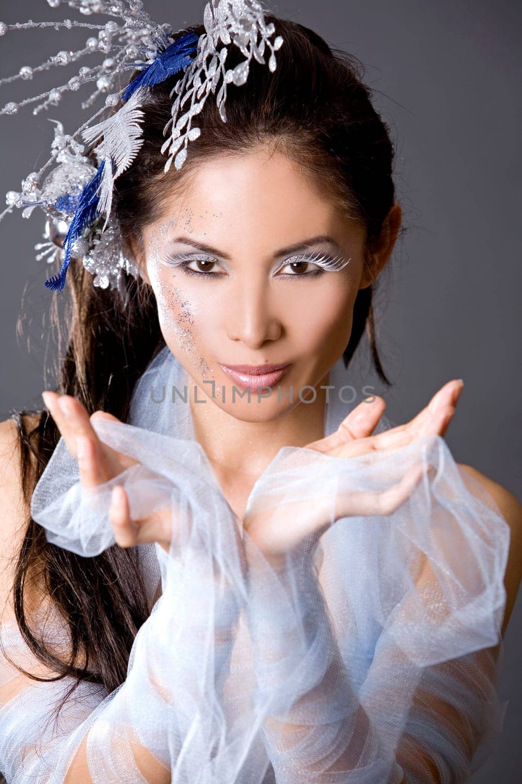 pretty brunette woman wearing white and silver accessories