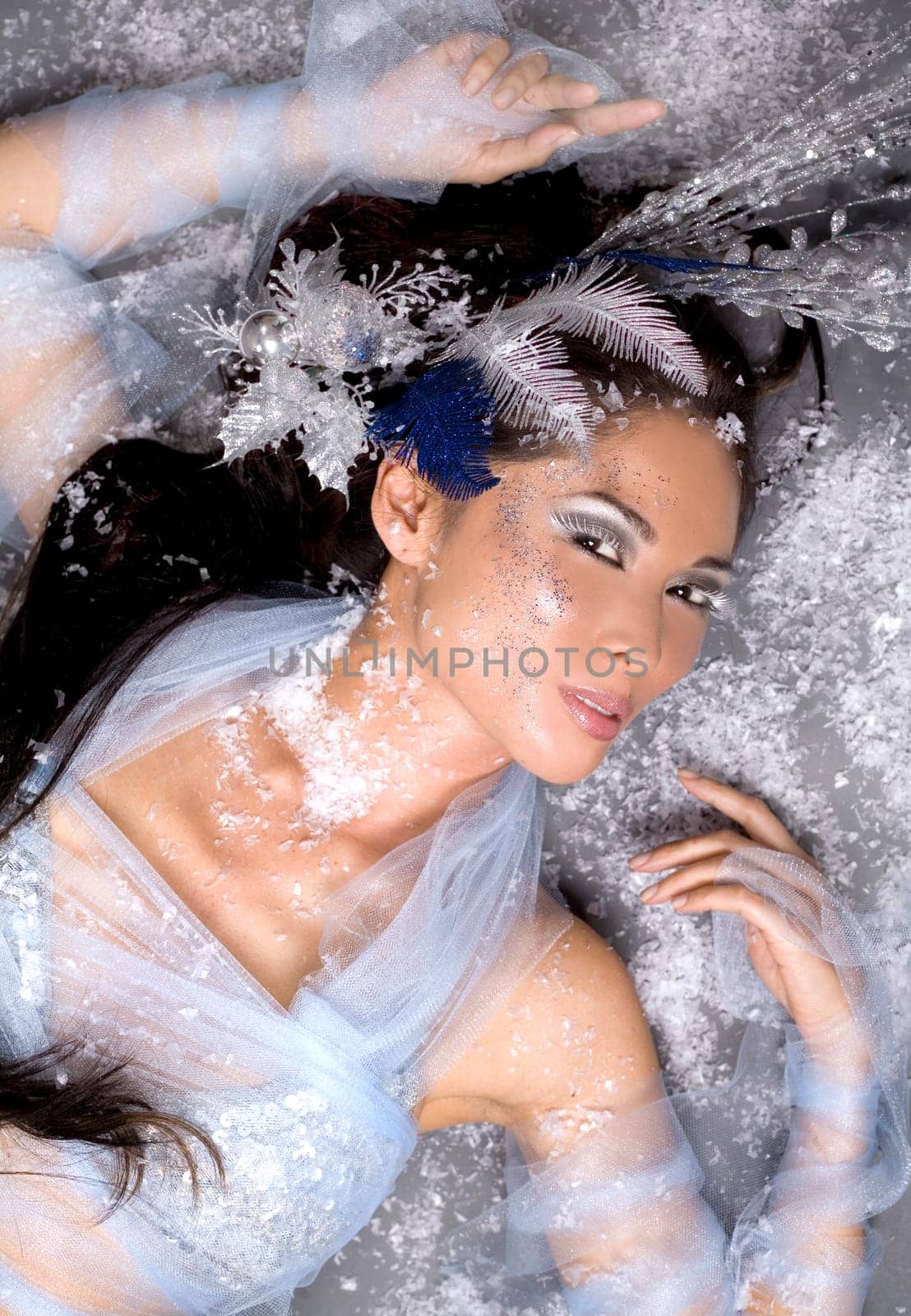 pretty brunette woman wearing white and silver accessories