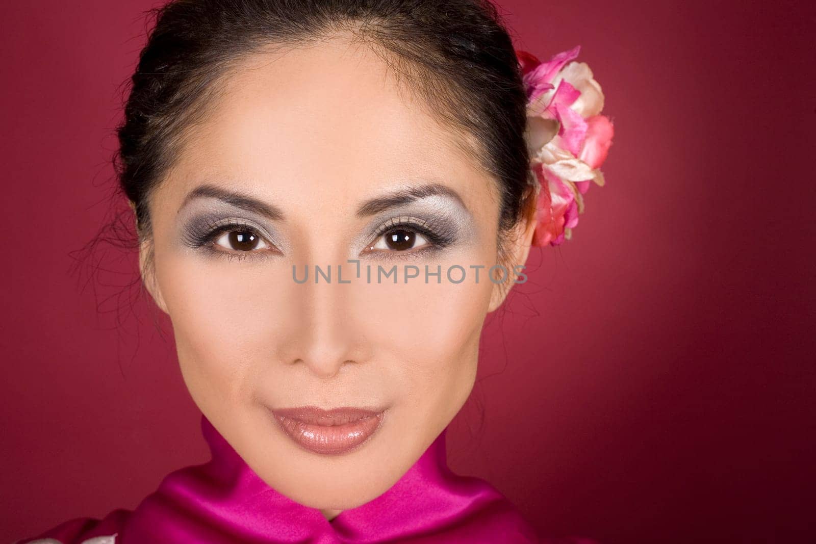 pretty asian woman wearing kimono on red background