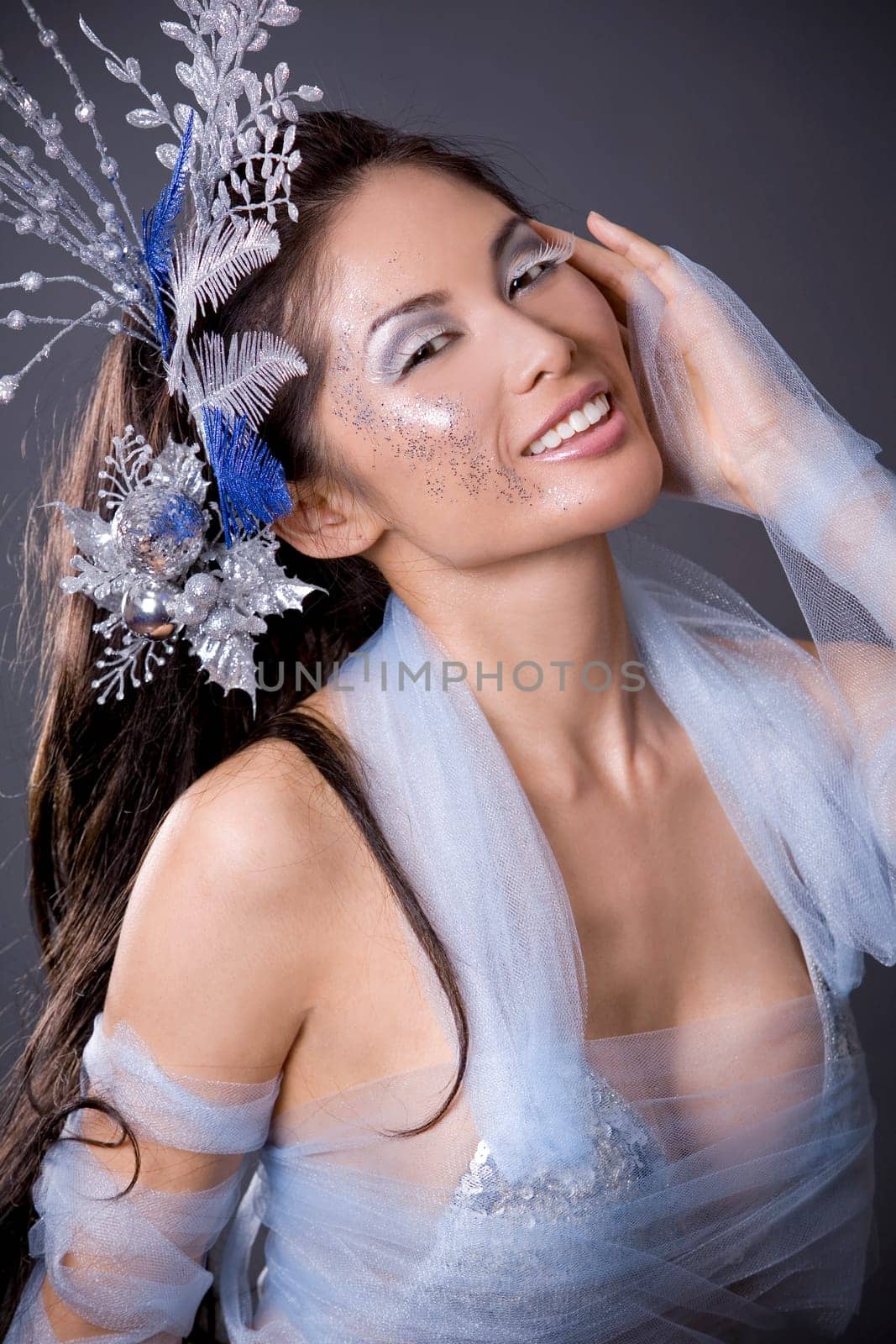pretty brunette woman wearing white and silver accessories