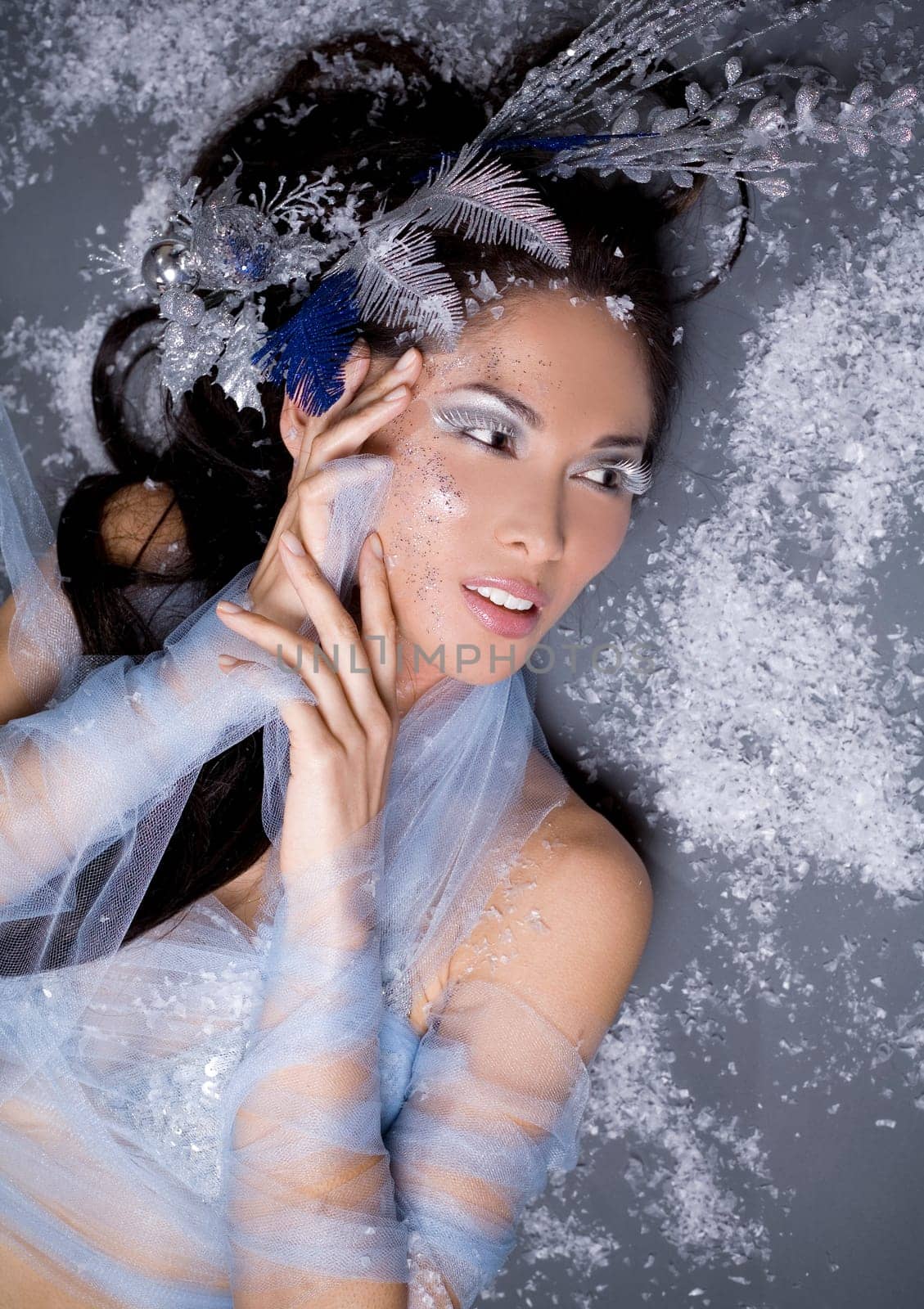 pretty brunette woman wearing white and silver accessories