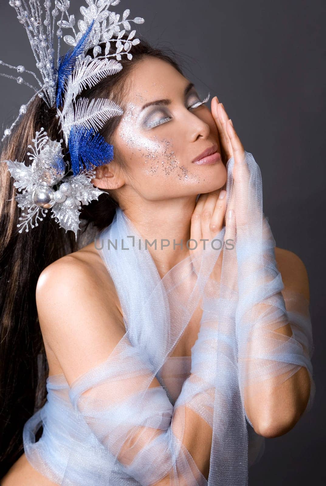 pretty brunette woman wearing white and silver accessories