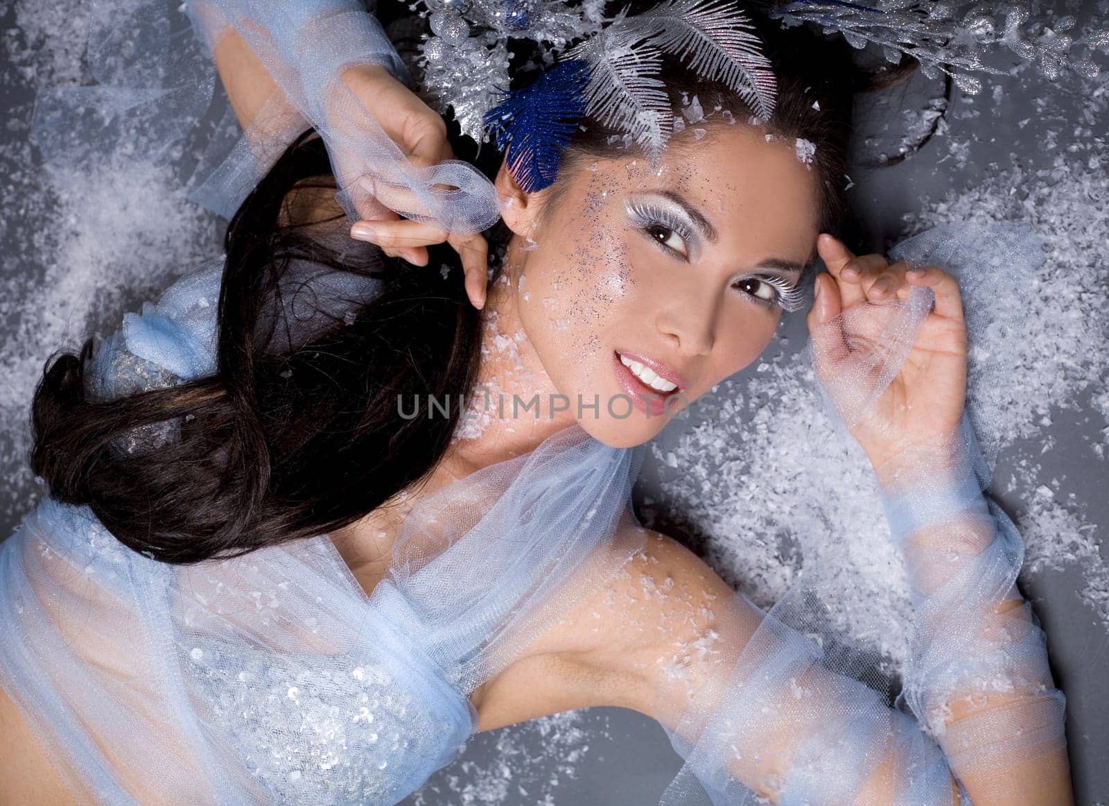 pretty brunette woman wearing white and silver accessories