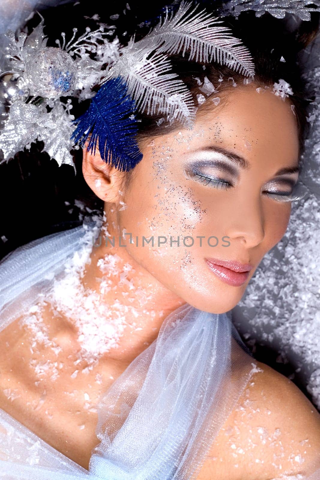 pretty brunette woman wearing white and silver accessories