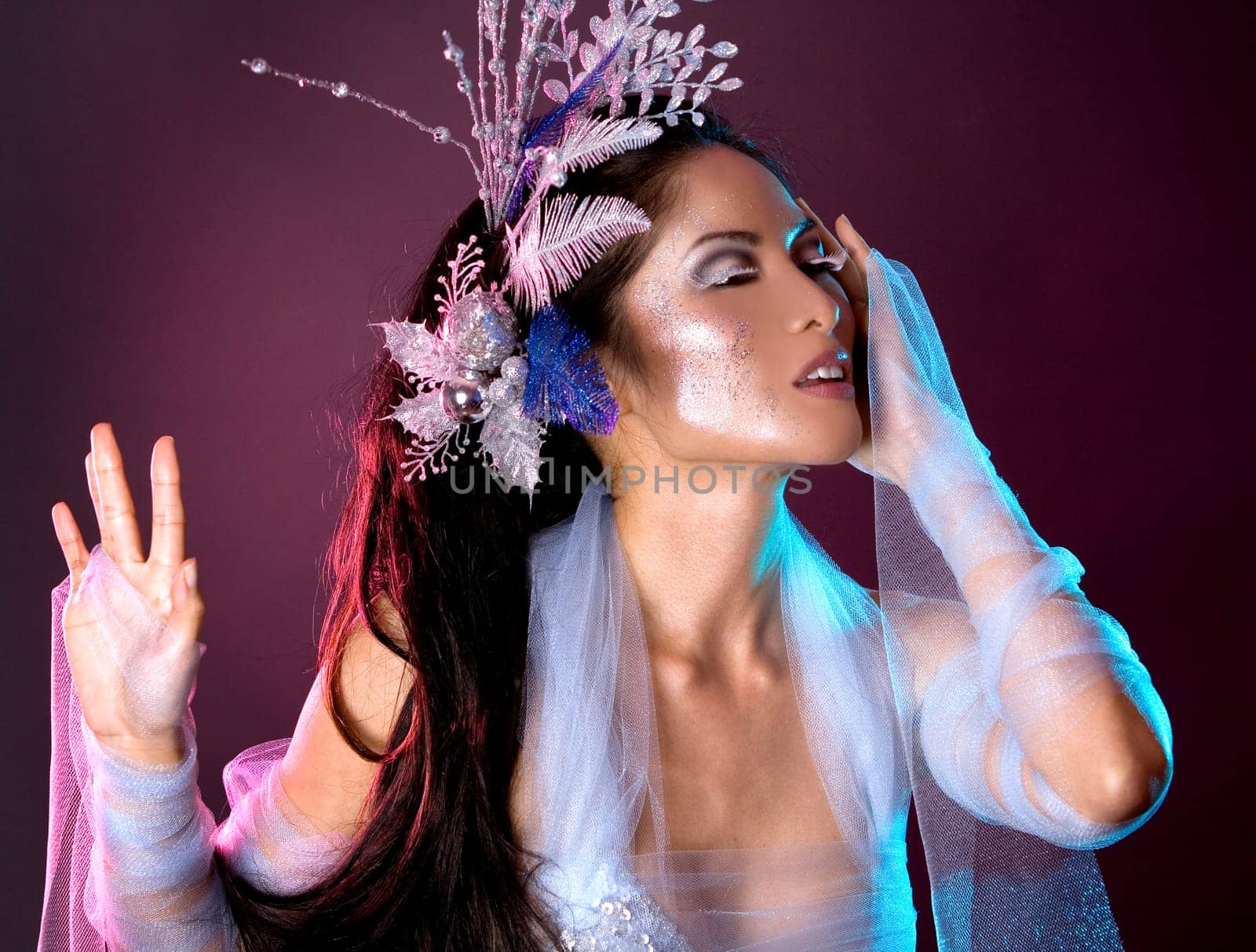 pretty brunette woman wearing white and silver accessories