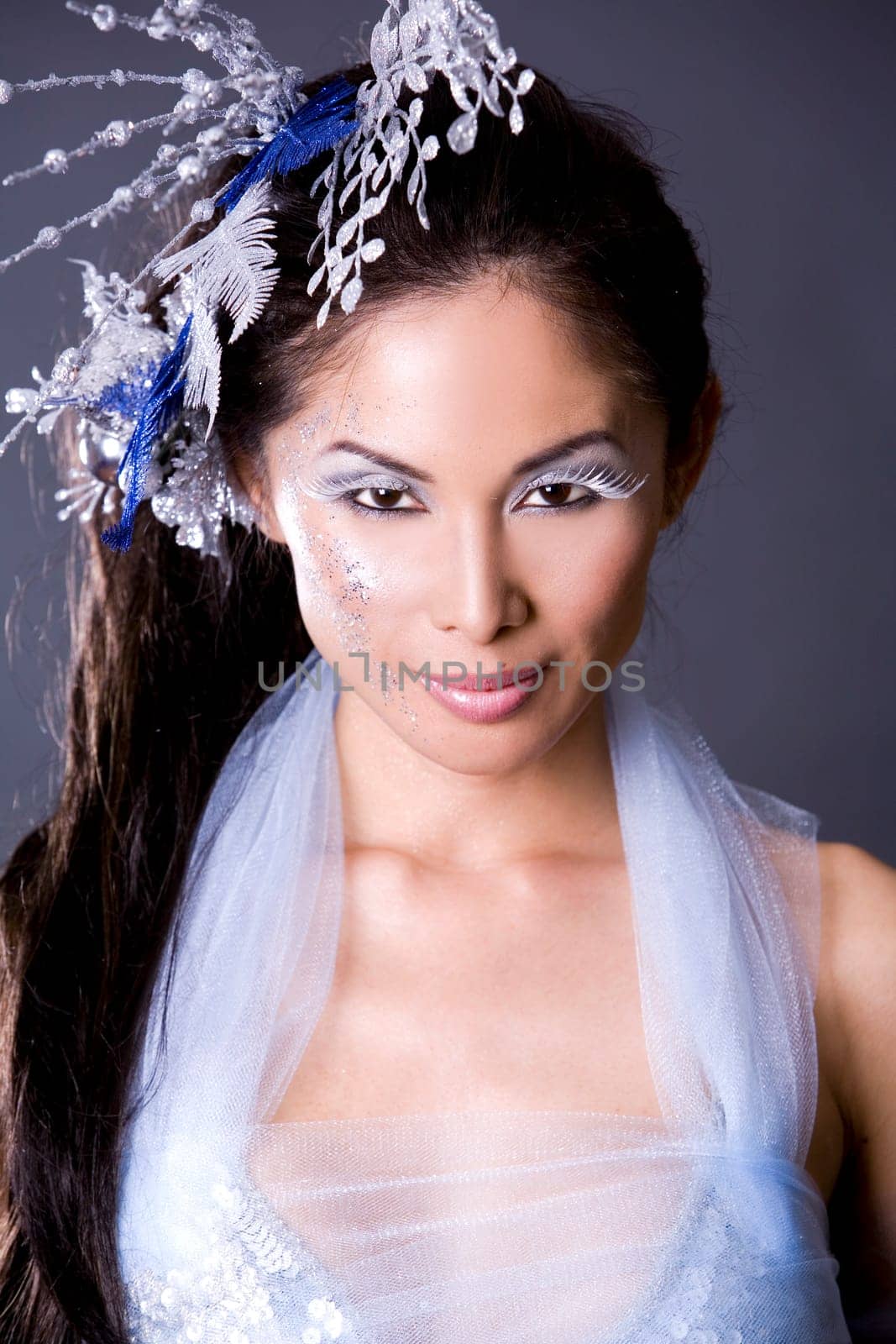 pretty brunette woman wearing white and silver accessories
