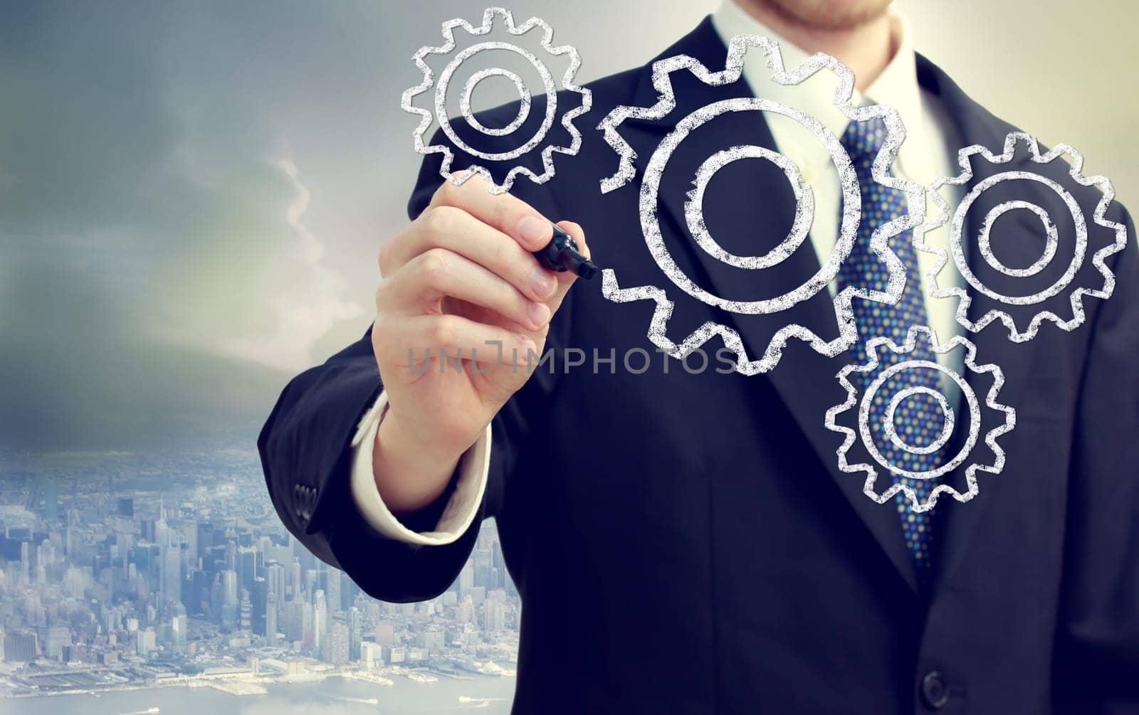Businessman with gears - concepts of teamwork, efficiency, interlocking parts.