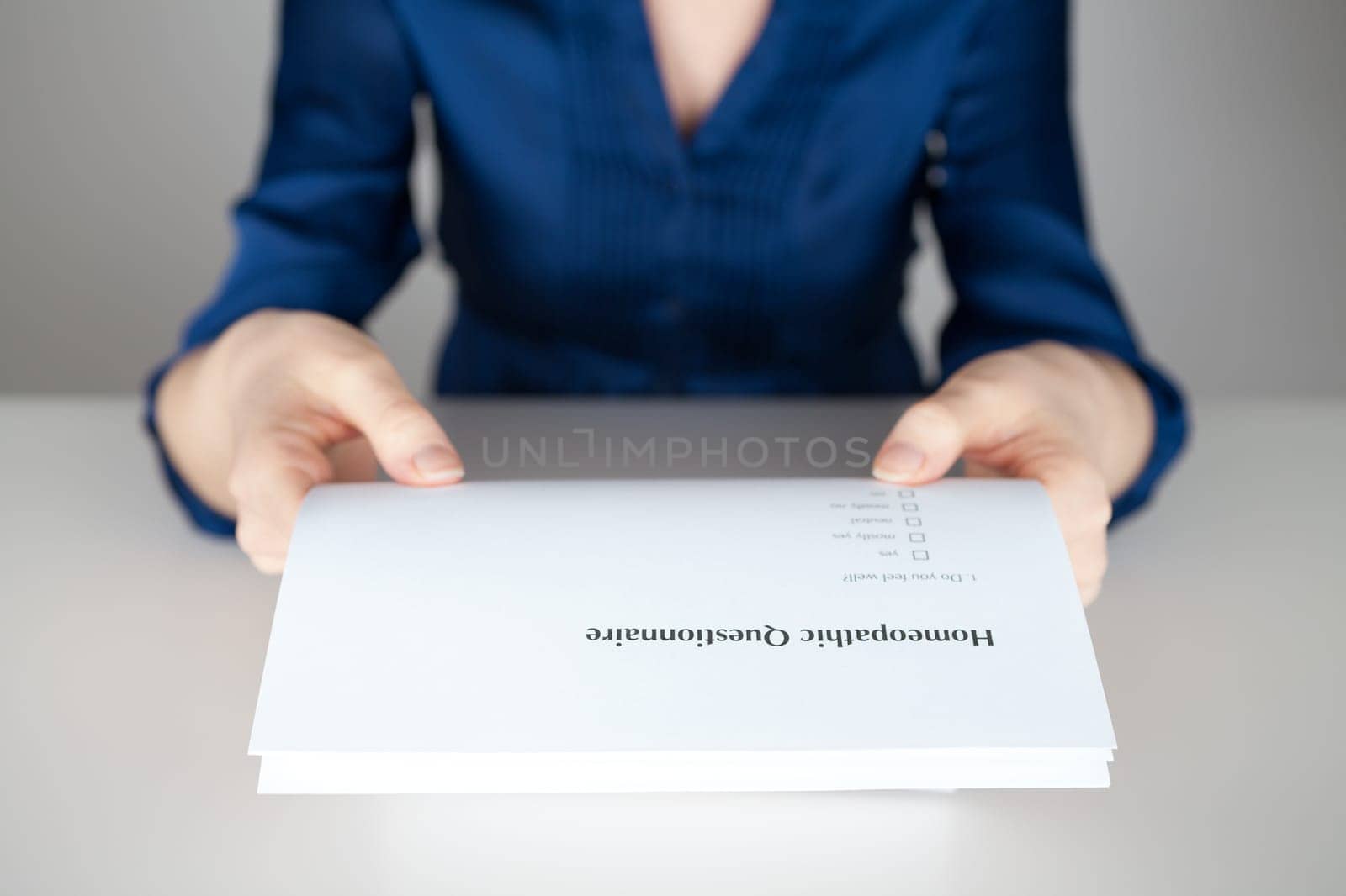 Homeopathic questionnaire concept - woman give you a questionnaire.