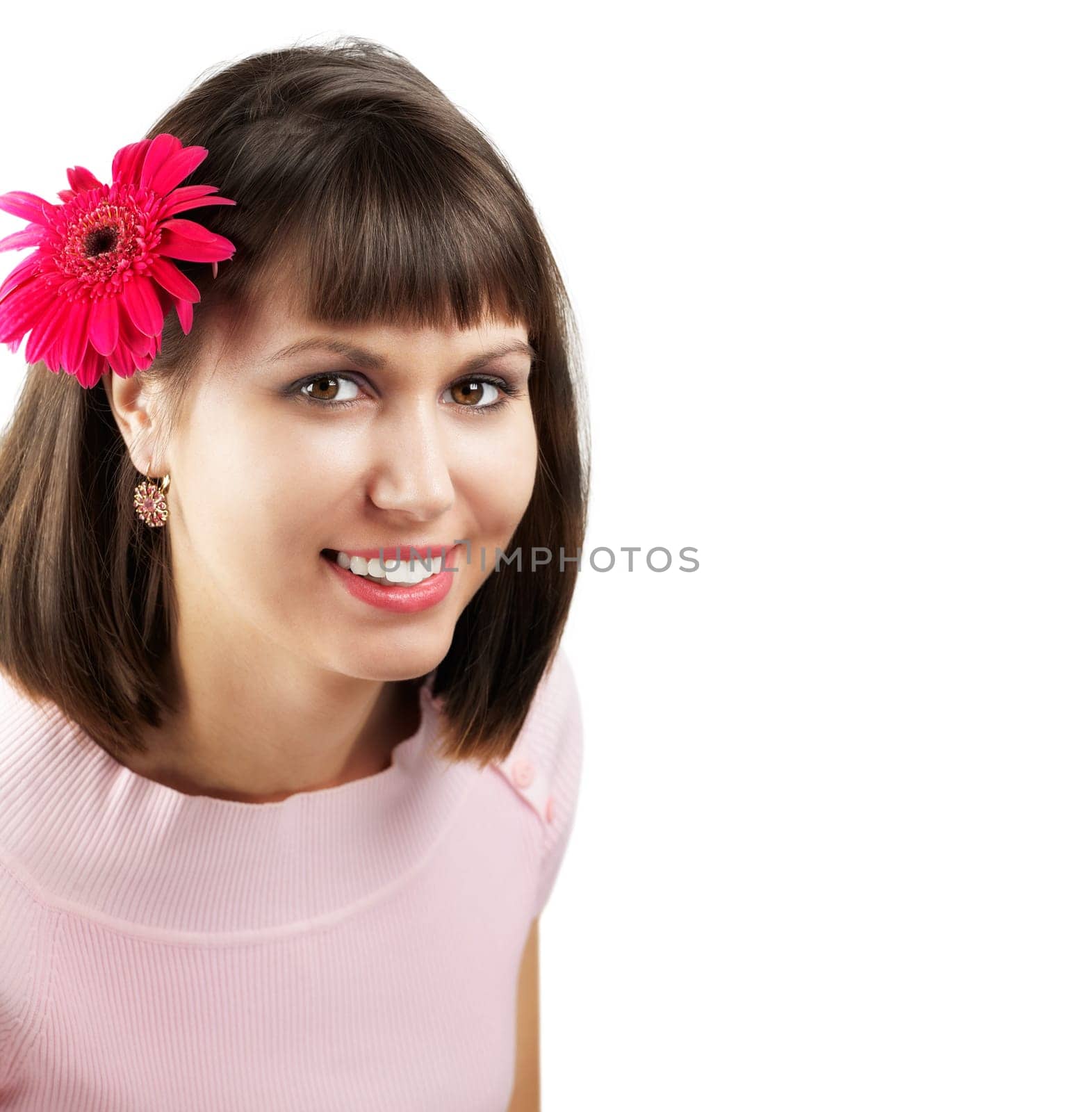 Portrait of a beautiful young woman with a flower in her hair isolated on white.