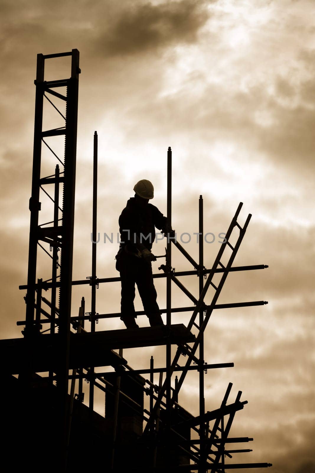 carpenter or construction worker at work with wooden  roof construction