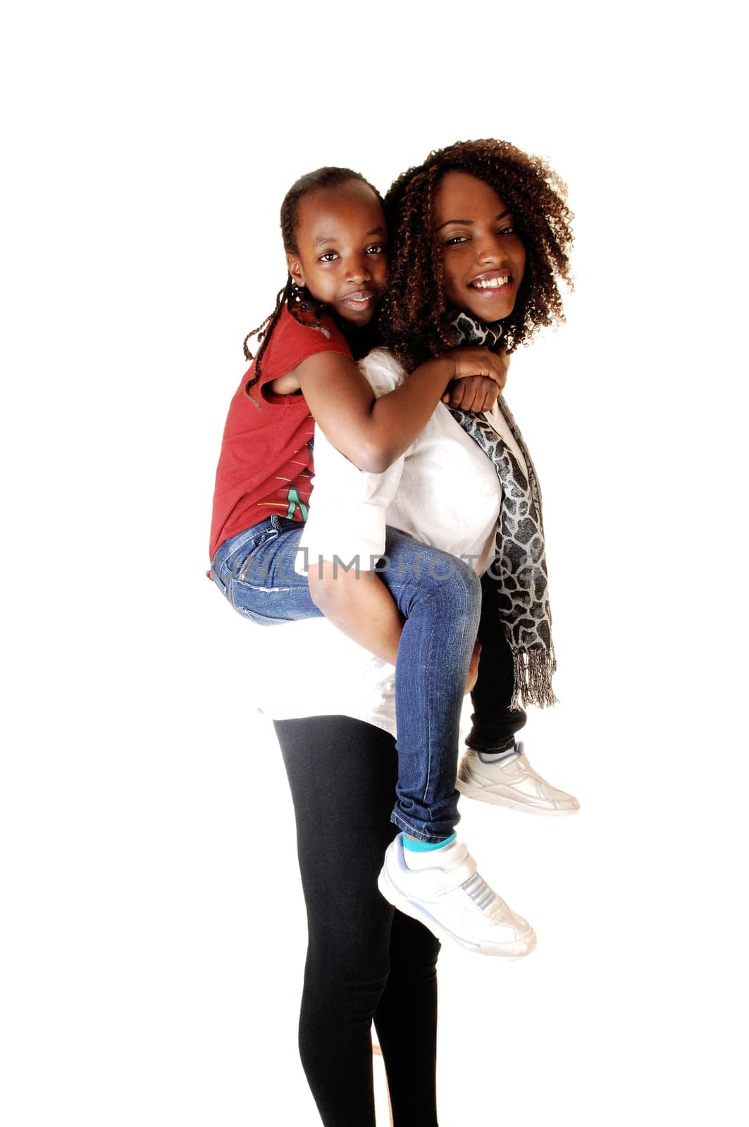 Two black sisters playing with each other, the small one sitting on the back of the older one, for white background.