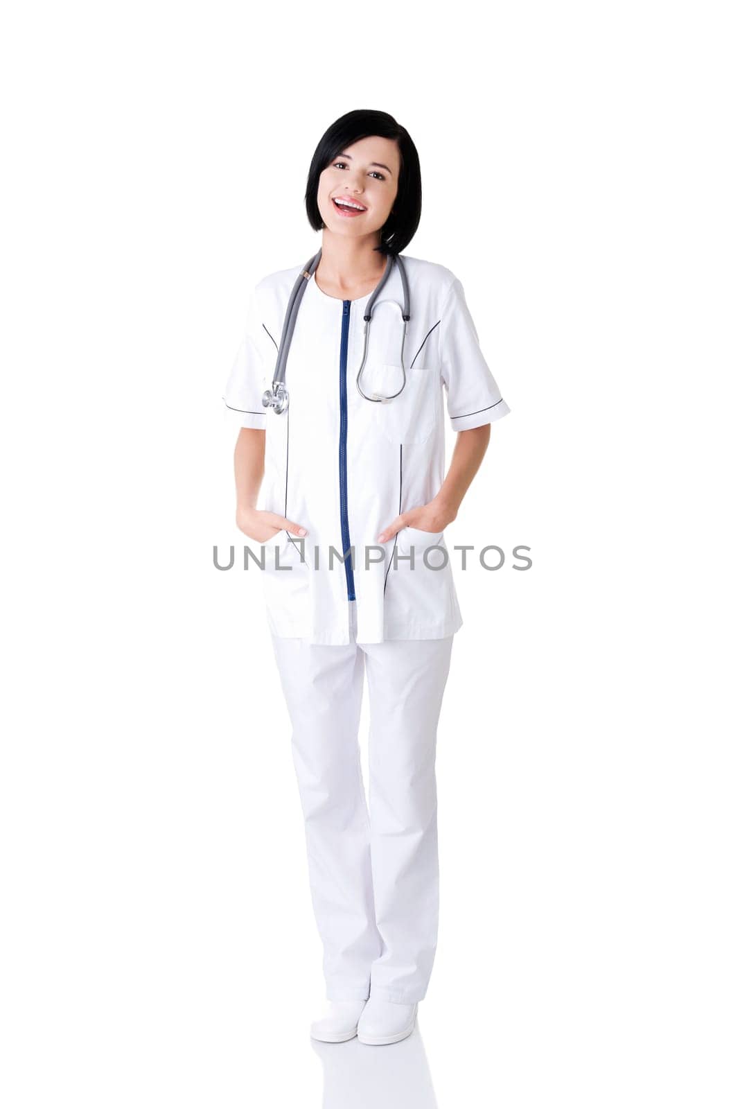 Nurse or young doctor standing smiling. Isolated on white background. Full body