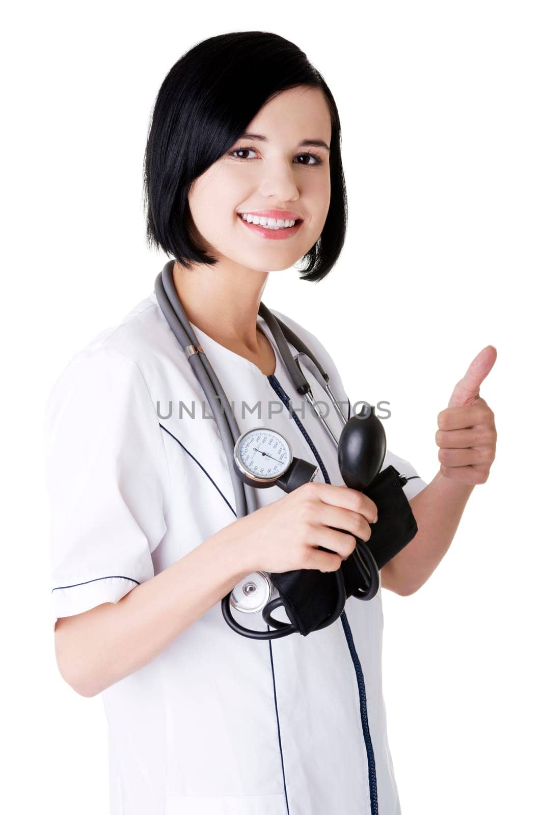 Woman doctor with blood pressure gauge gesturing thumbs up