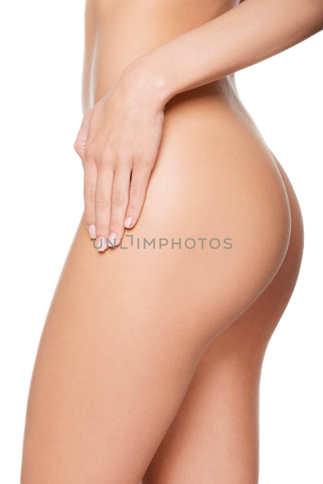 Slim tanned woman's body. Isolated over white background.