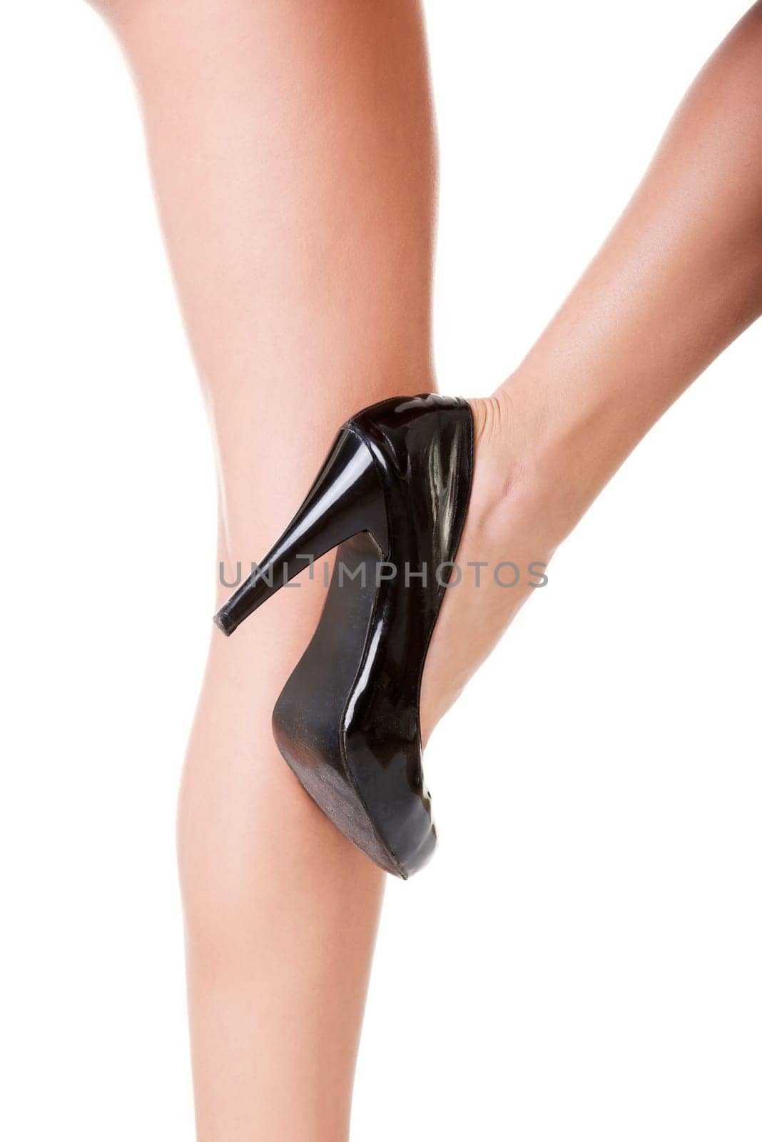 Woman's leg and high heel shoes ,isolated on white