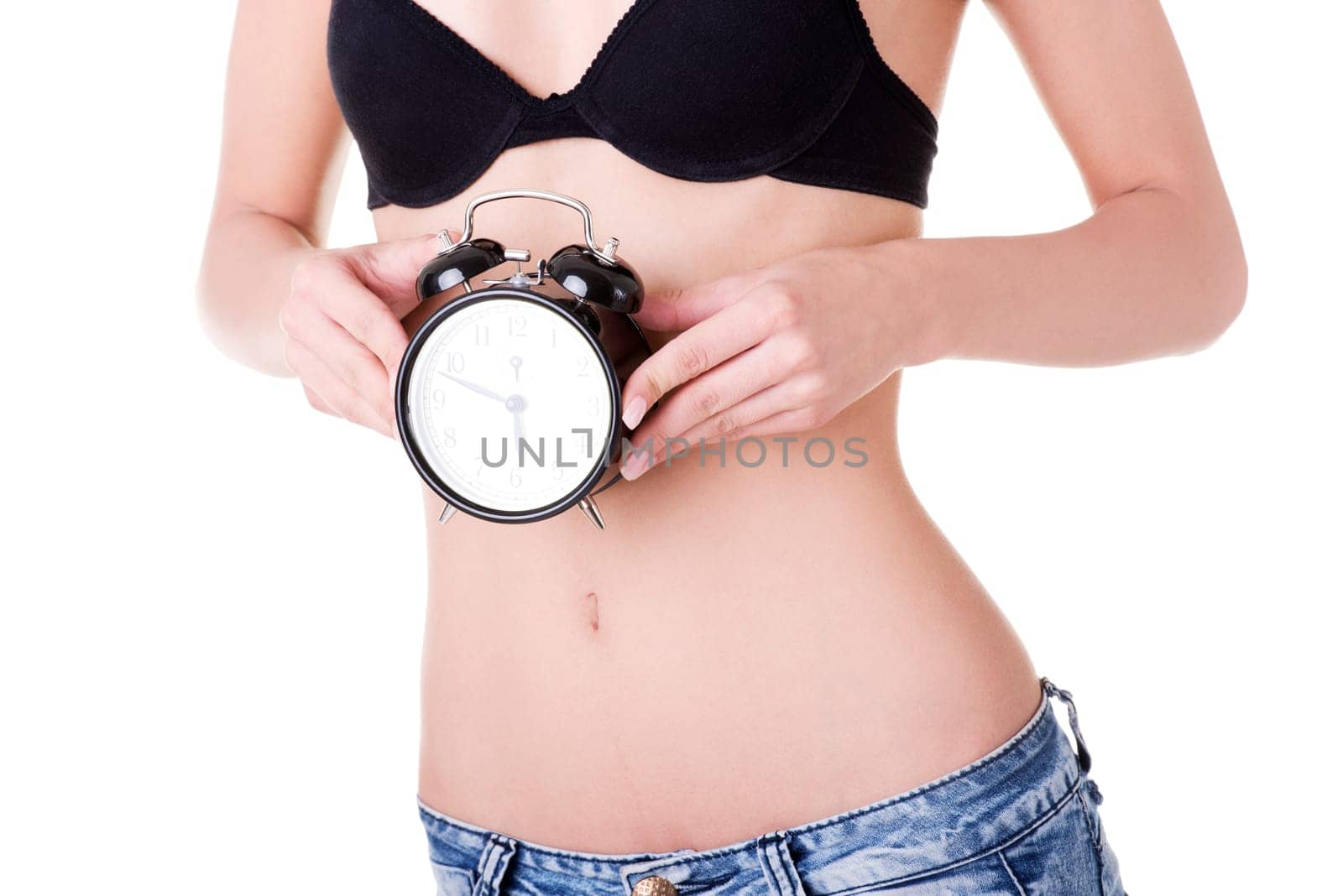 Beautiful fit belly woman with clock on belly