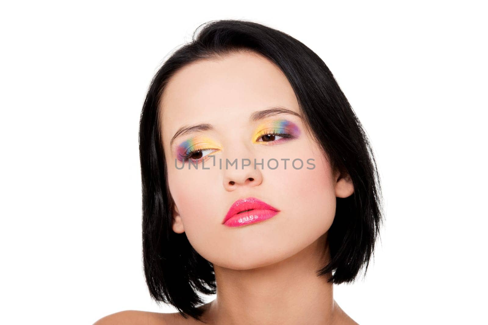 Beautiful woman with rainbow eye make up, isolated on white