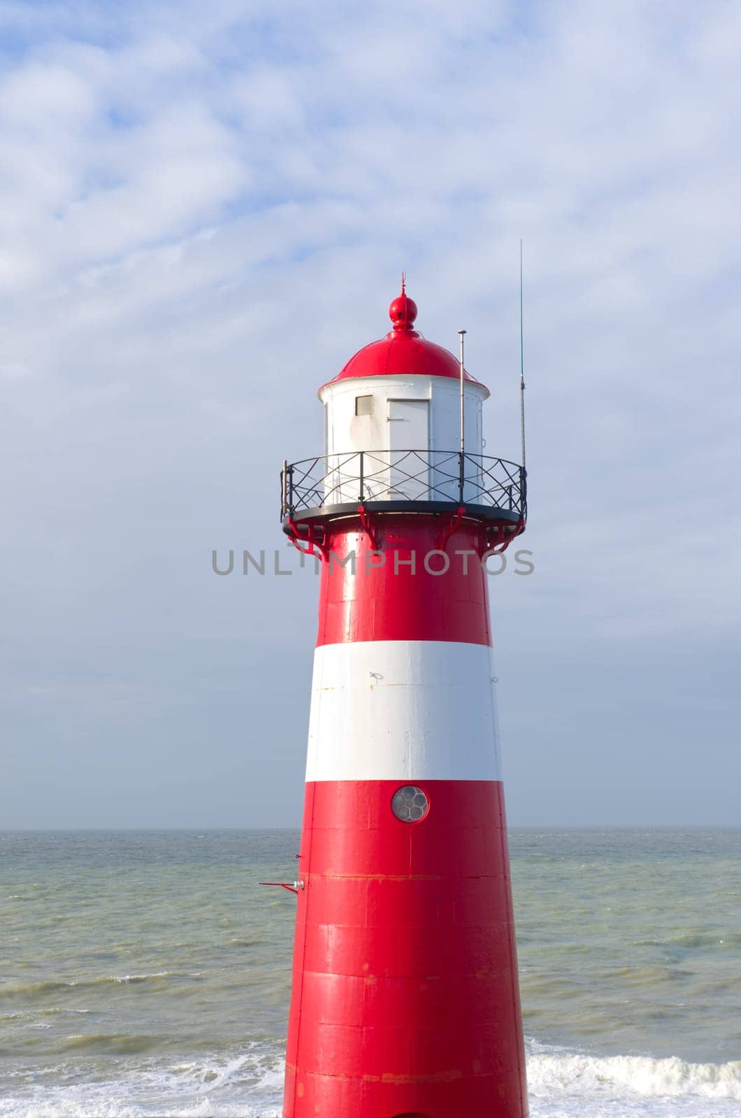 "Noorderhoofd""  lighthouse in Westkapelle, Netherlands. It has 3 colors of light, white (6000 candela), red and green (1800 candela). Together with the main lighthouse in the village it sends a light beacon to the ""Oostgat""."