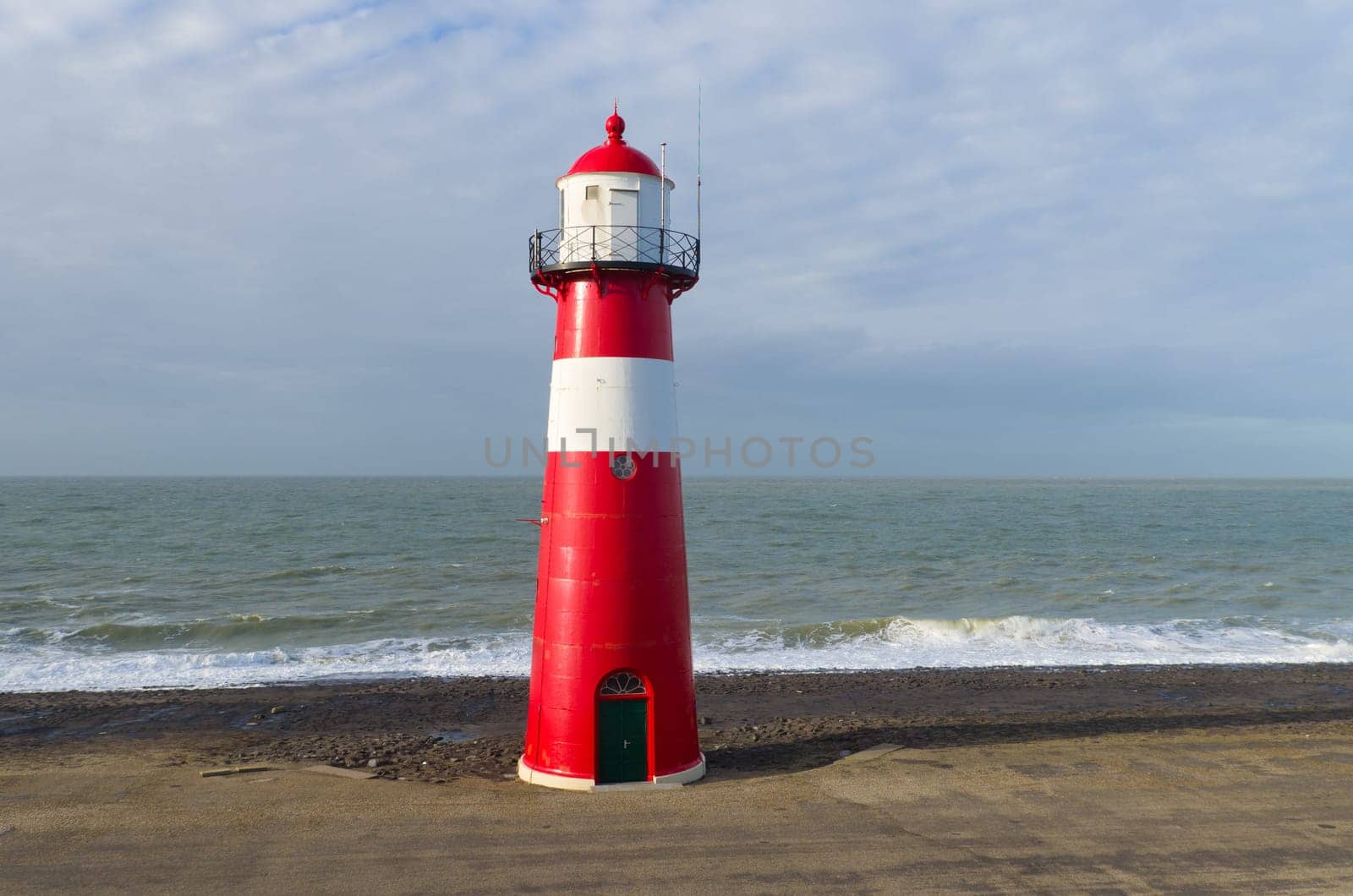 "Noorderhoofd""  lighthouse in Westkapelle, Netherlands. It has 3 colors of light, white (6000 candela), red and green (1800 candela). Together with the main lighthouse in the village it sends a light beacon to the ""Oostgat""."
