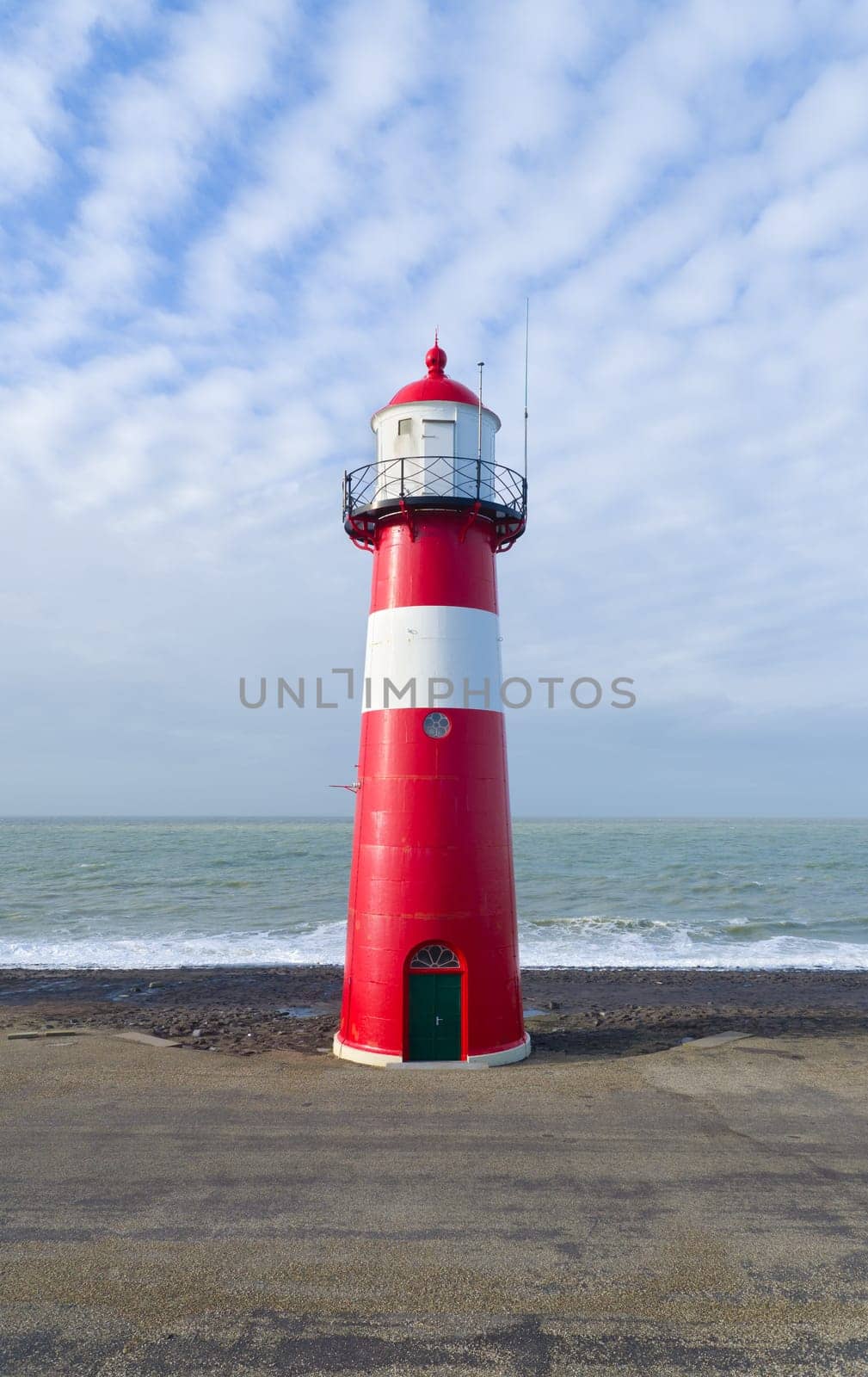 "Noorderhoofd""  lighthouse in Westkapelle, Netherlands. It has 3 colors of light, white (6000 candela), red and green (1800 candela). Together with the main lighthouse in the village it sends a light beacon to the ""Oostgat""."