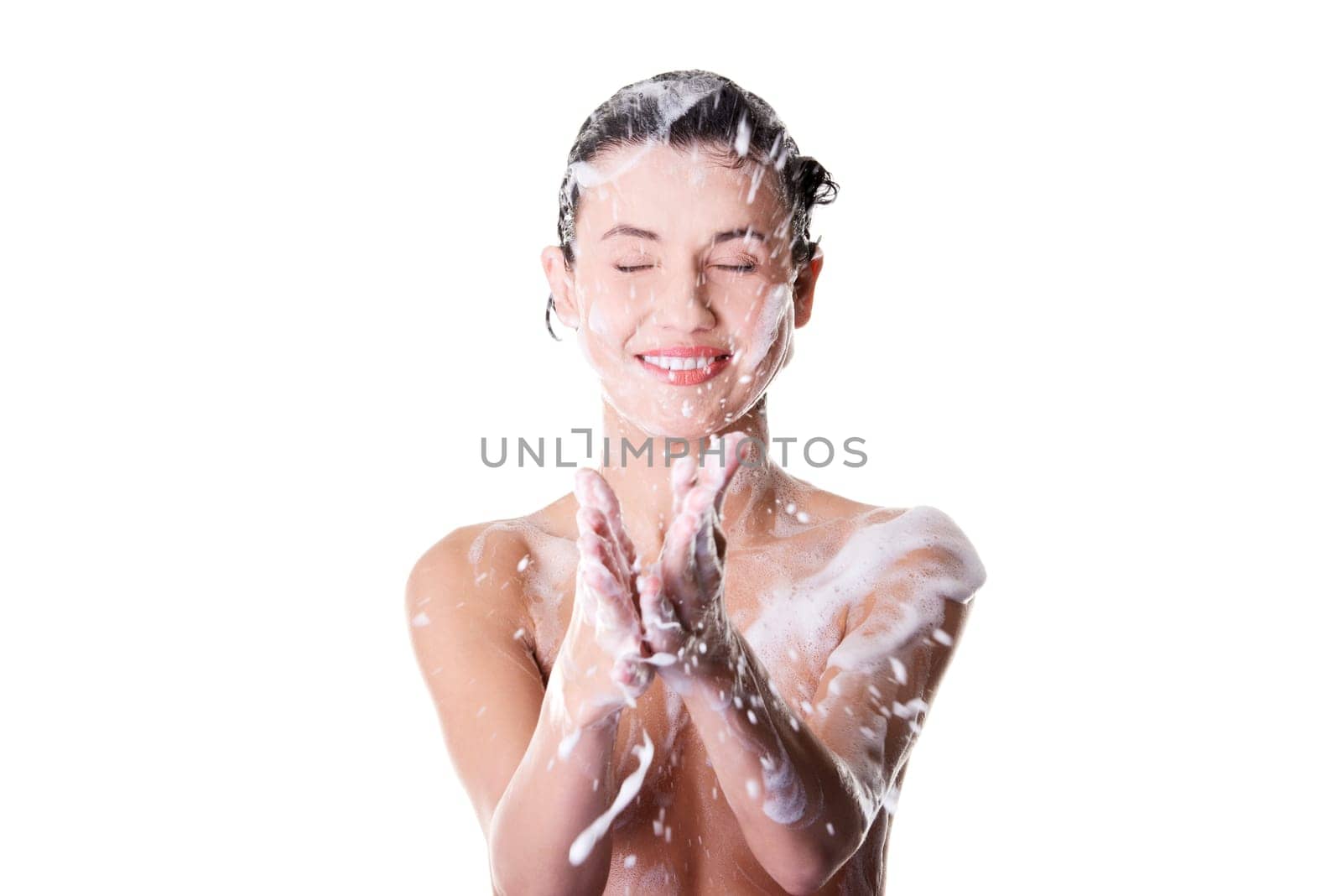 Young fit beautiful woman in shower washing her perfect fit body