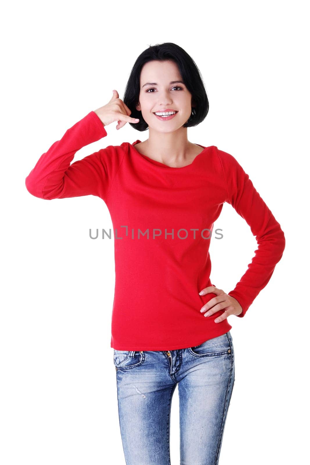 Young happy woman gesturing "call me"""