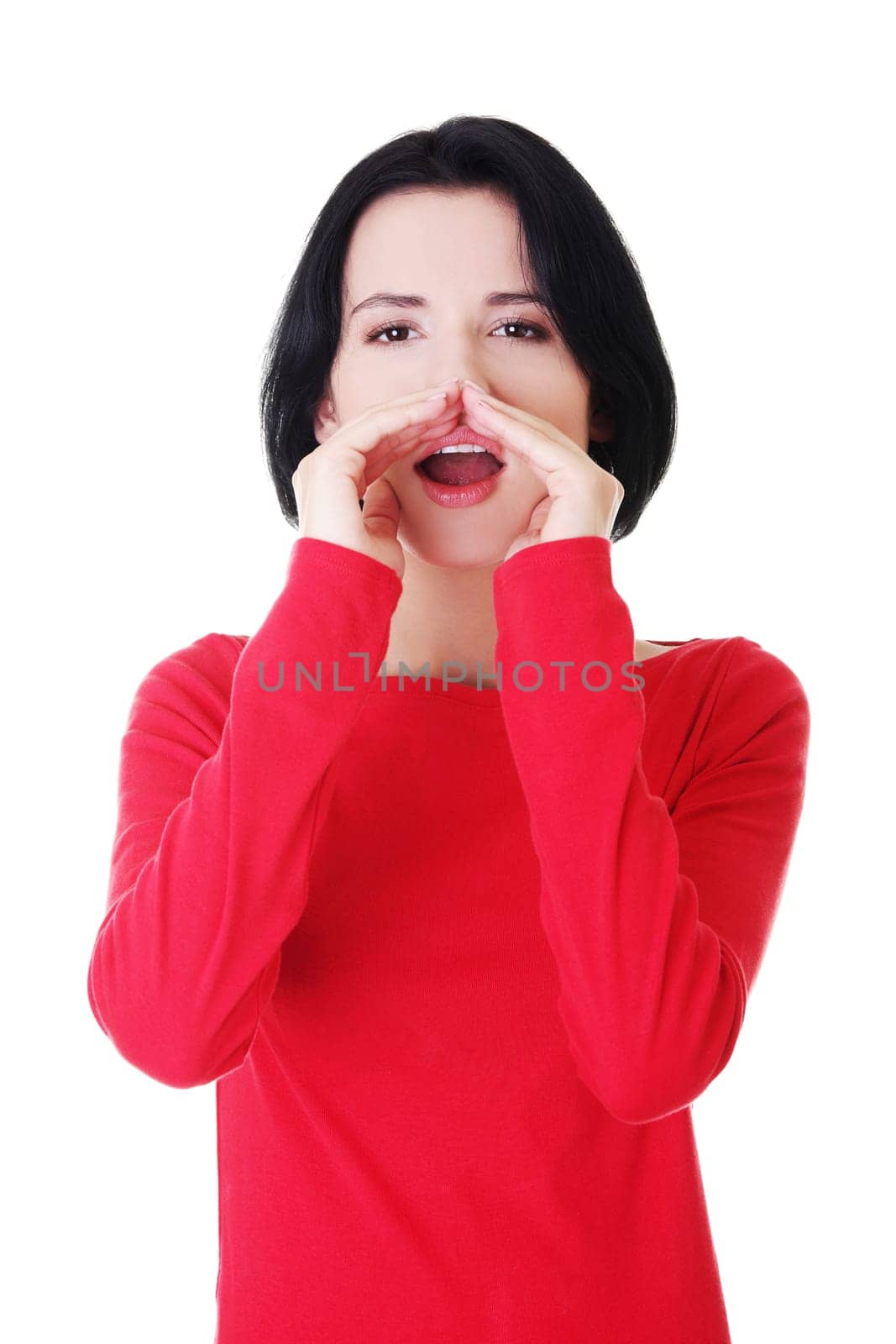 Pretty caucasian woman whispering gossip. Isolated on white.