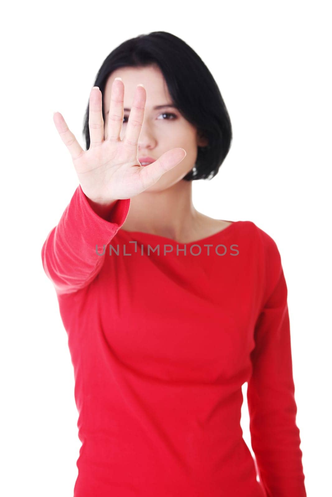 Confident woman making stop gesture sing with hand