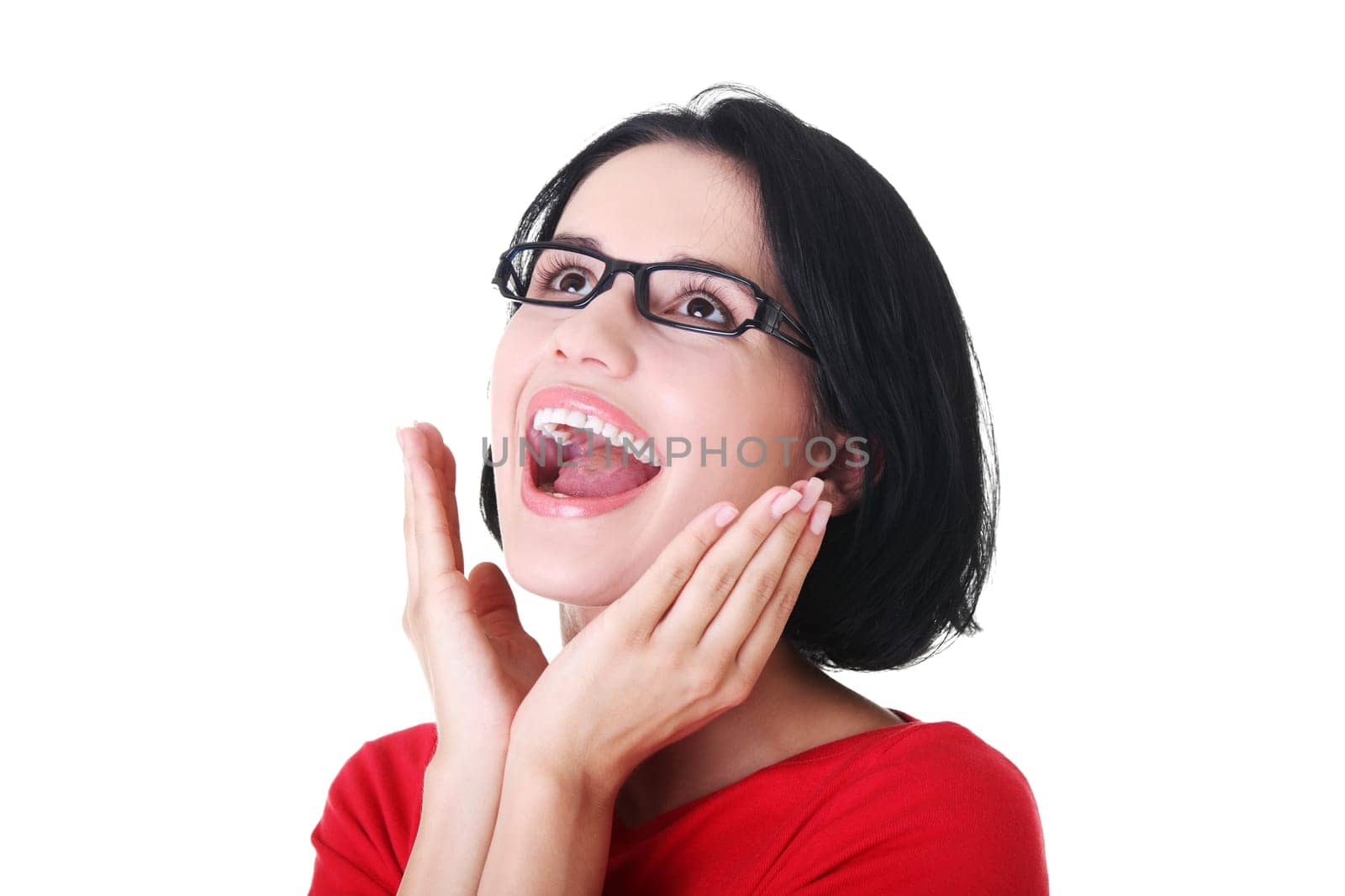 Portrait of a happy young woman looking up - isolated on white