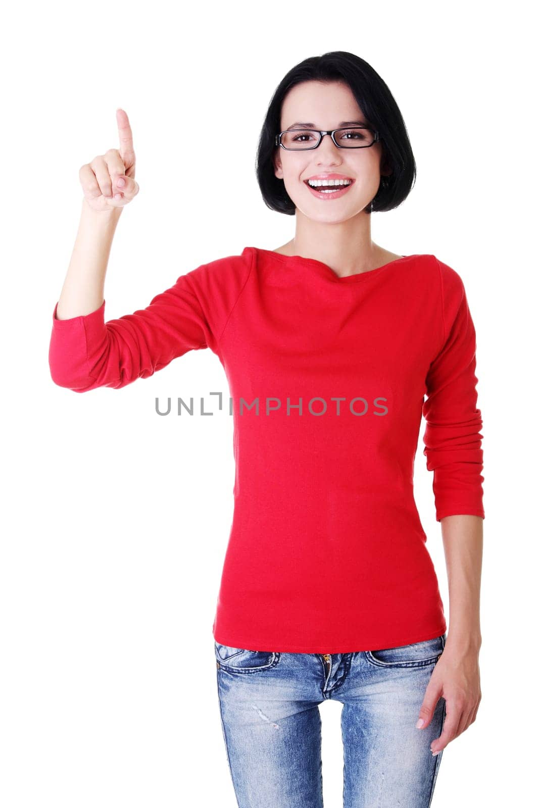 Happy , excited young woman pointing on copy space, isolated on white