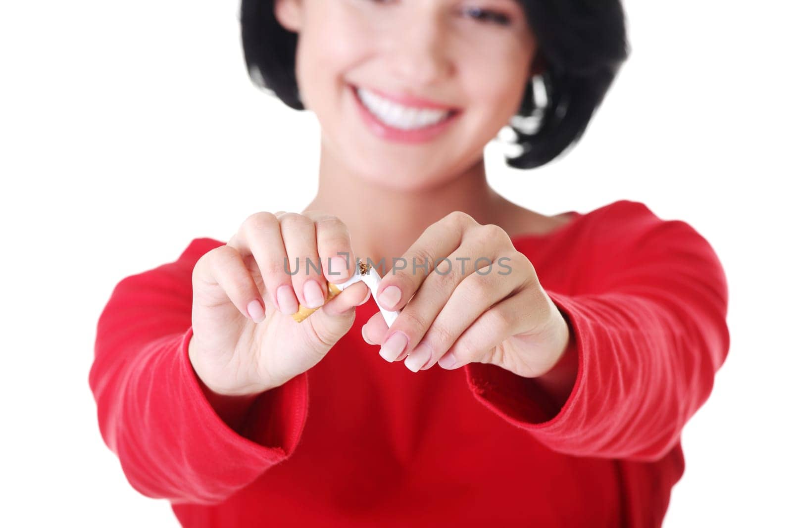 Young woman with broken cigarette. Stop smoking concept.