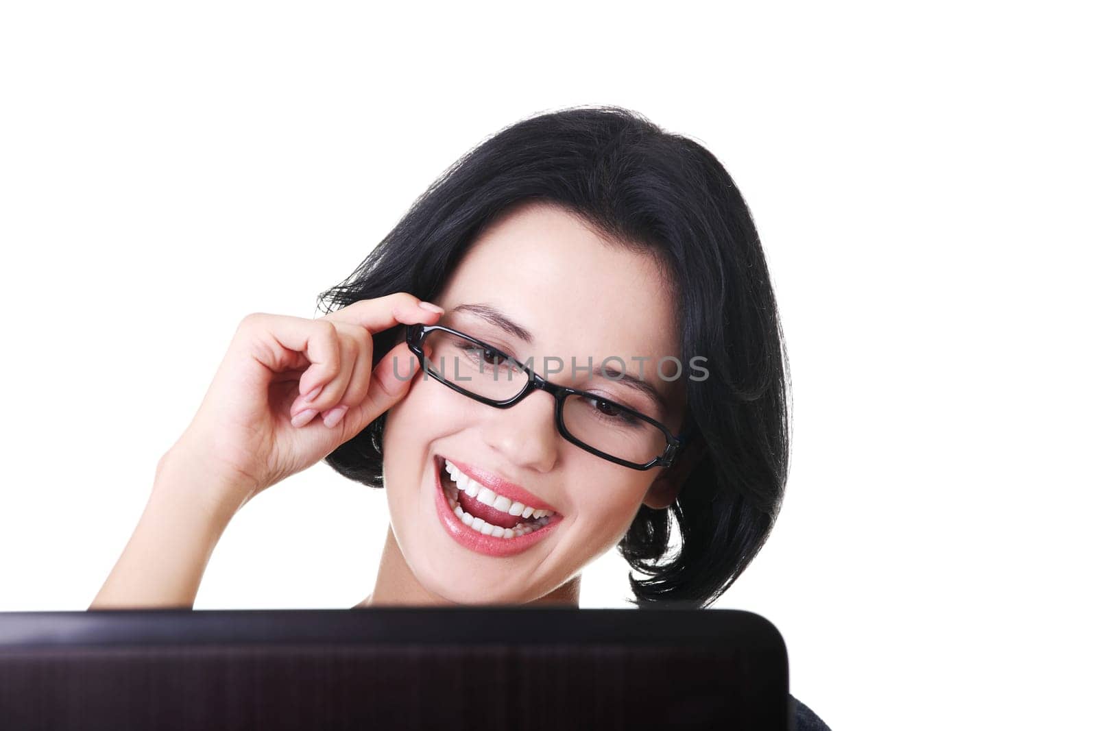 Happy young woman using her laptop, isolated on white.