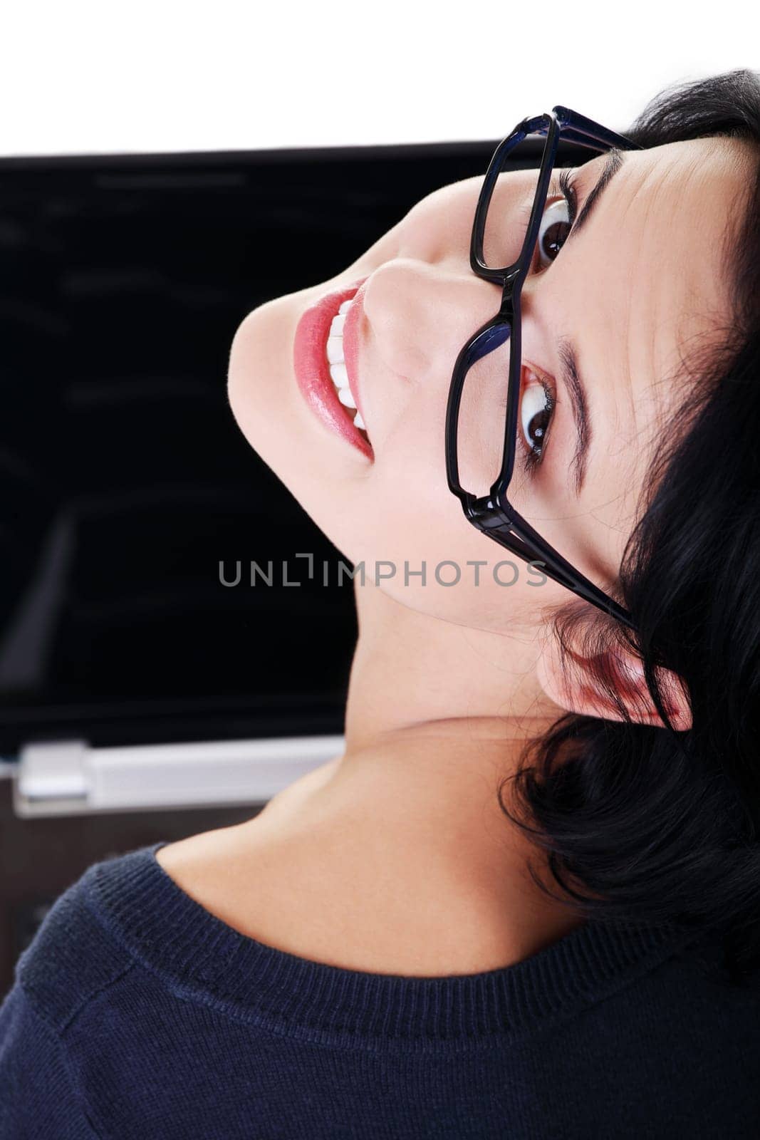 Happy young woman using her laptop, isolated on white.