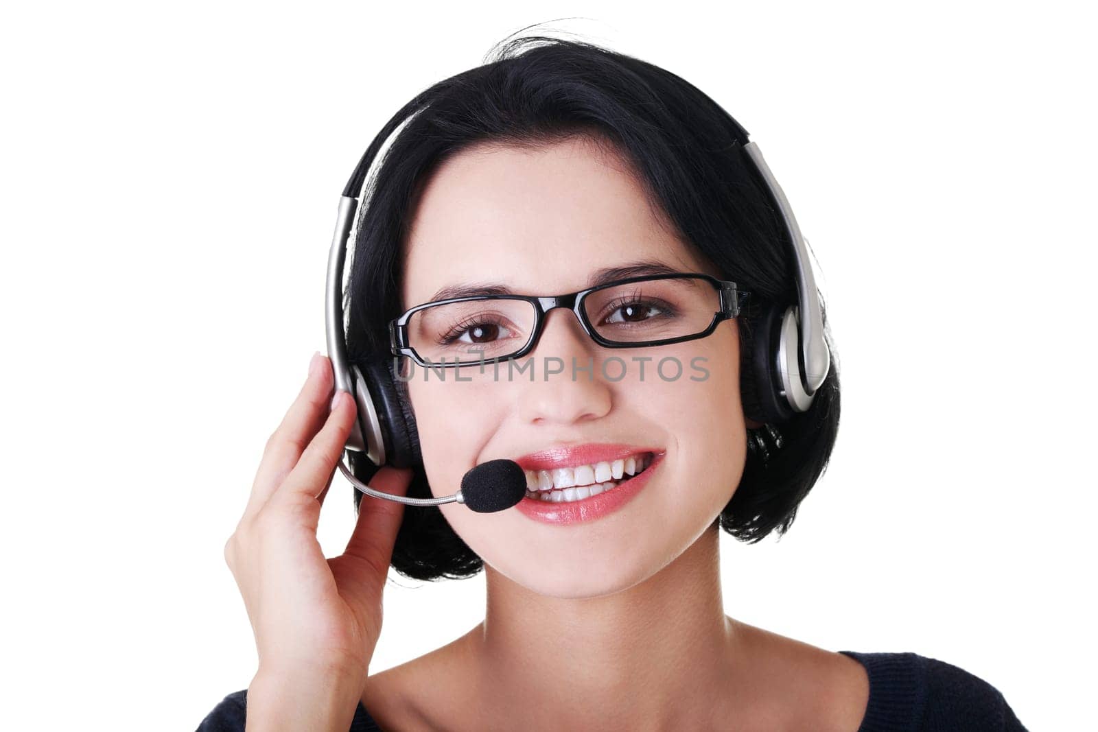 Closeup of attractive customer support representative smiling with headset on white background