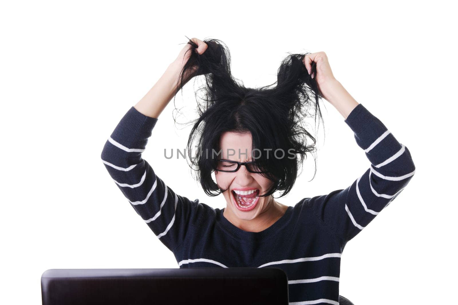 Frustrated woman working on laptop, isolated on white